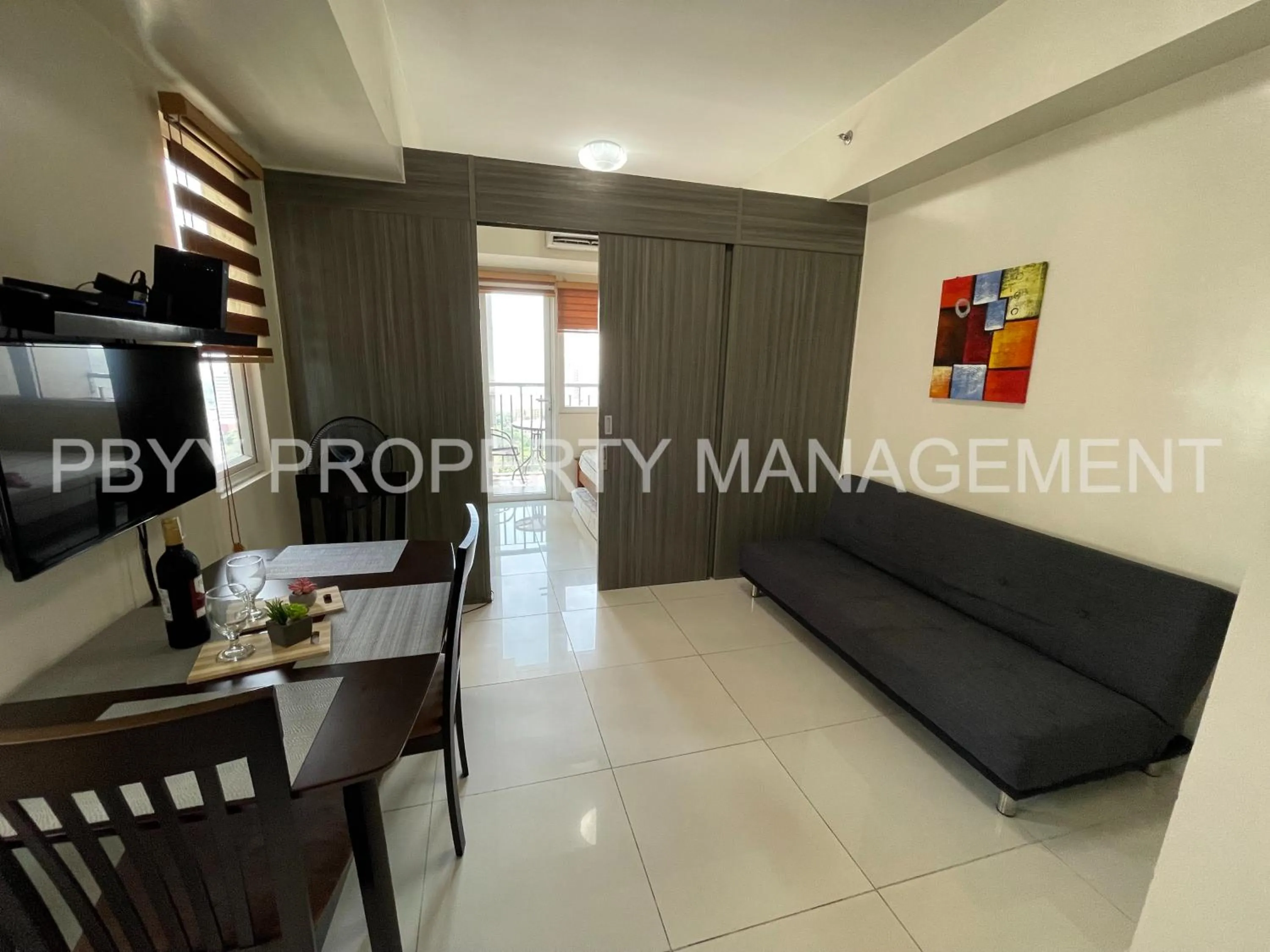 Living room in Green Residences Stays by PBYY