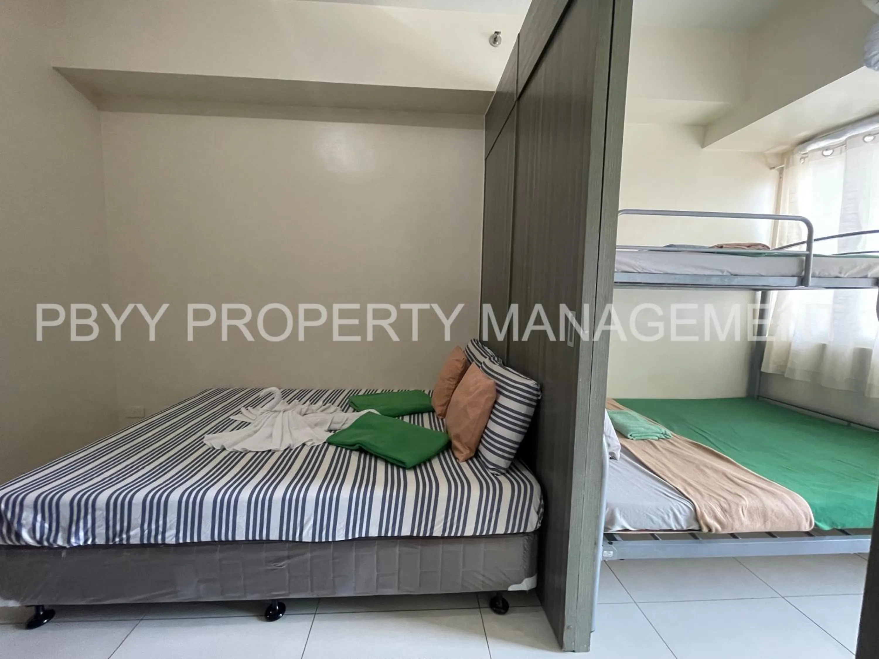 Bed, Bunk Bed in Green Residences Stays by PBYY