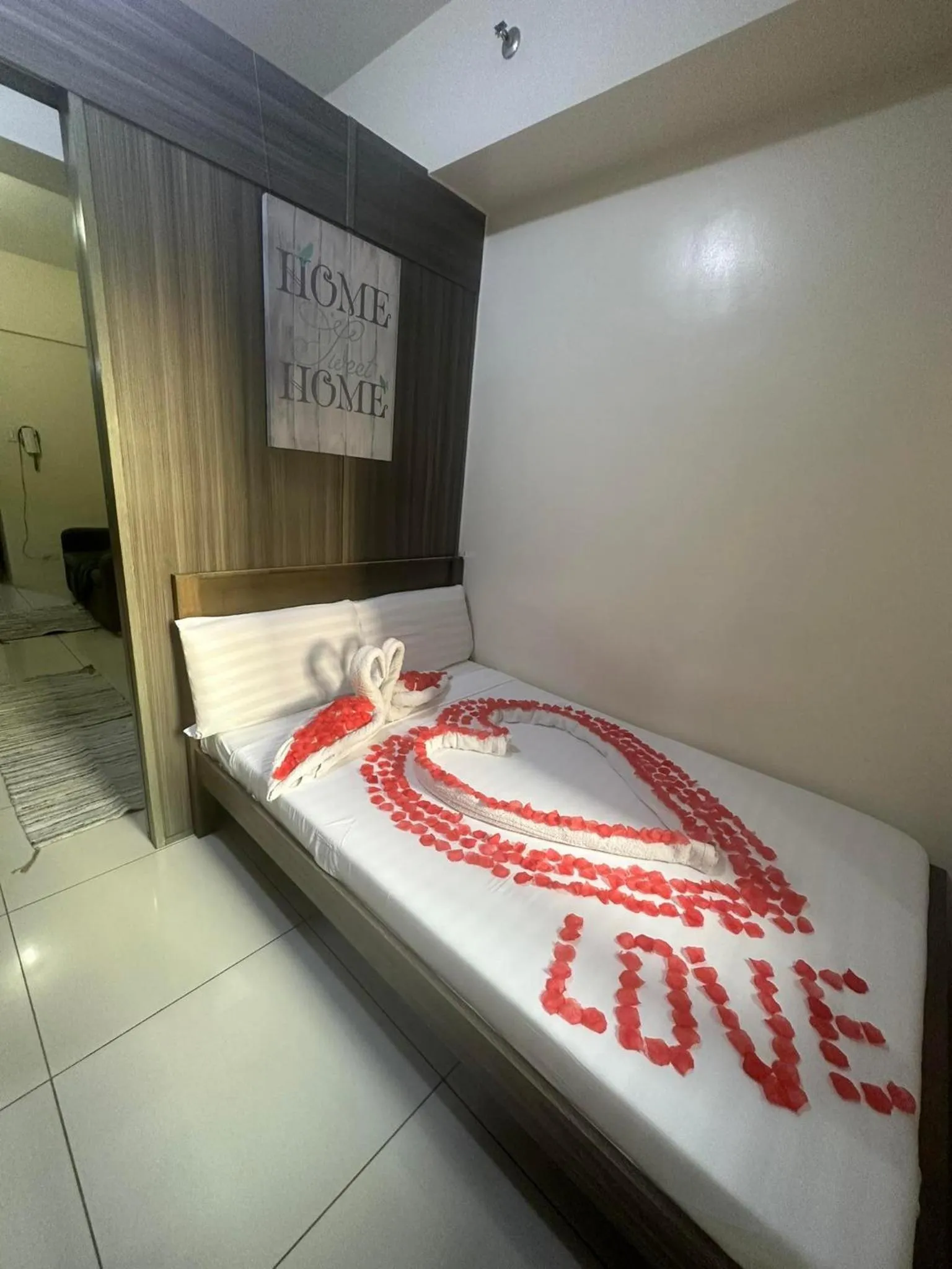 Bed in Green Residences Stays by PBYY