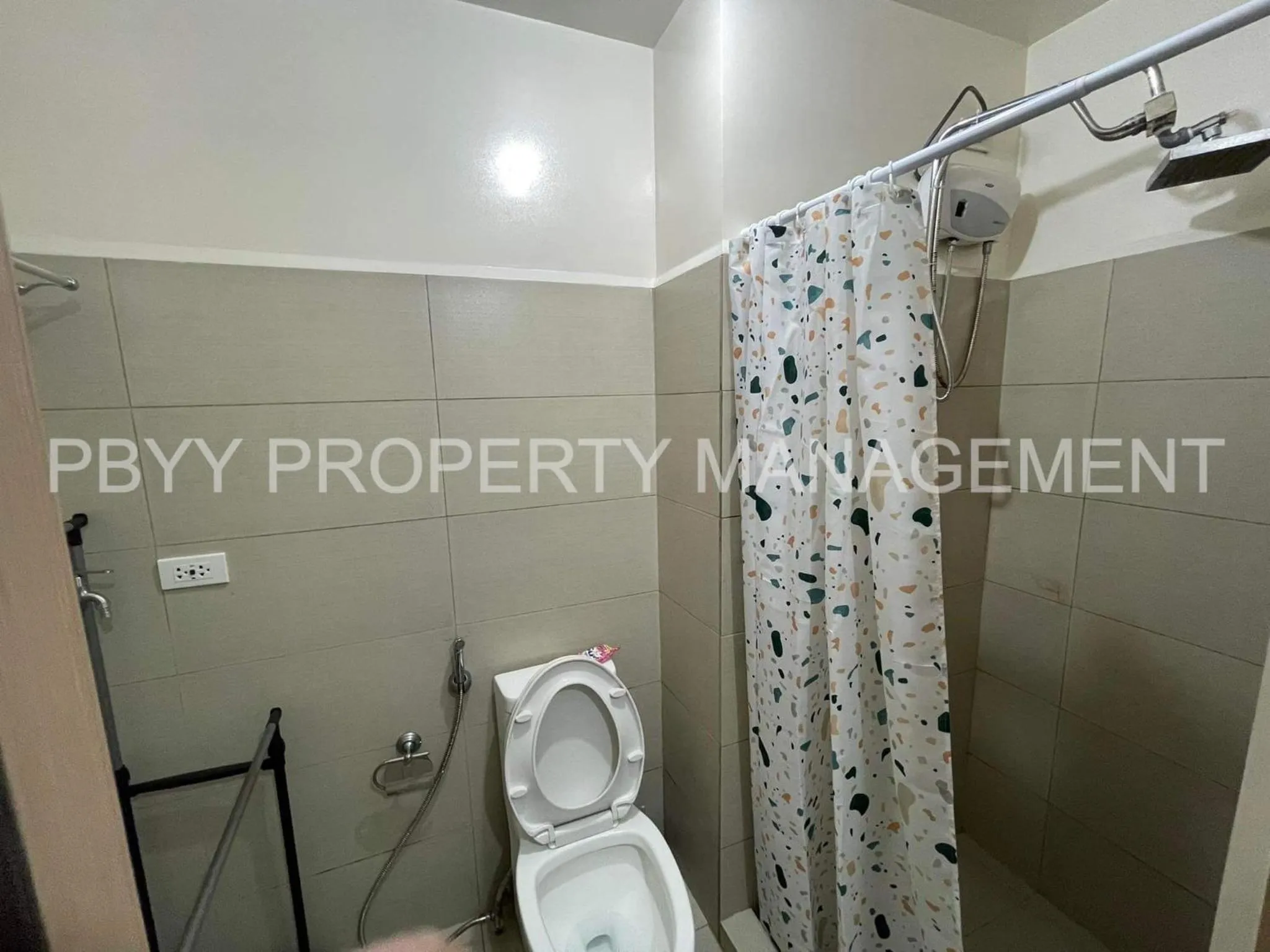 Bathroom in Green Residences Stays by PBYY