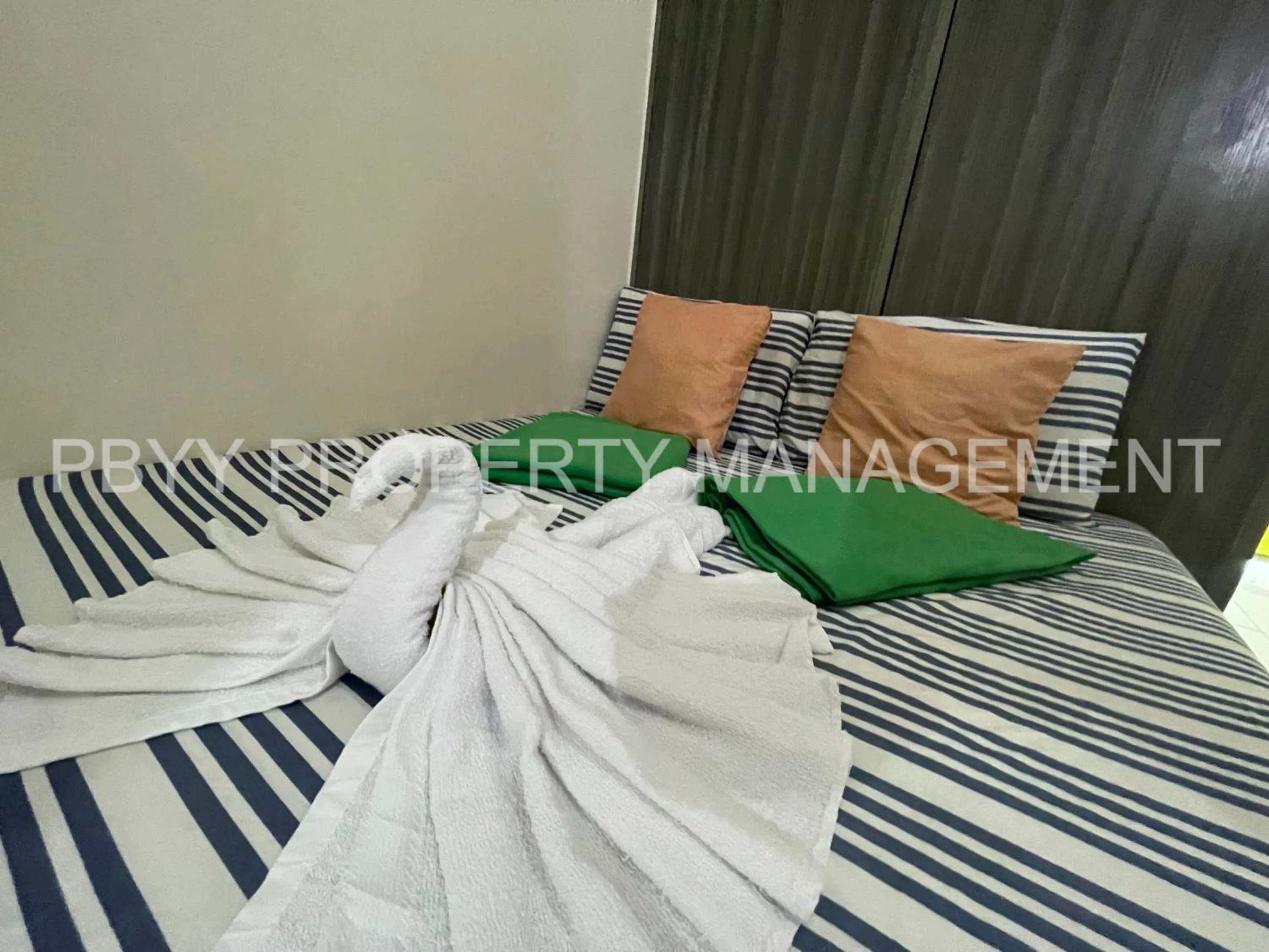 Bed in Green Residences Stays by PBYY