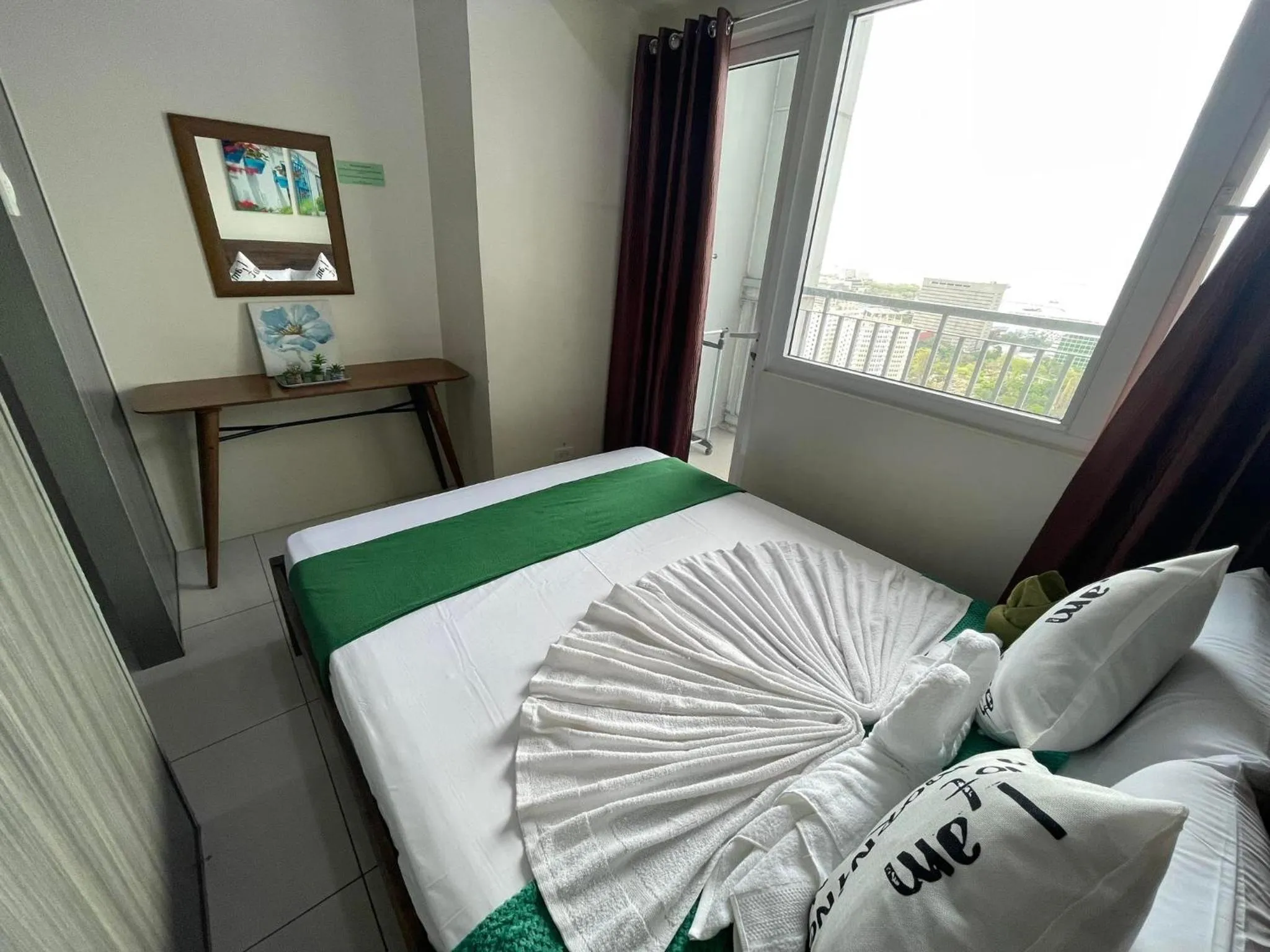 Bed in Green Residences Stays by PBYY