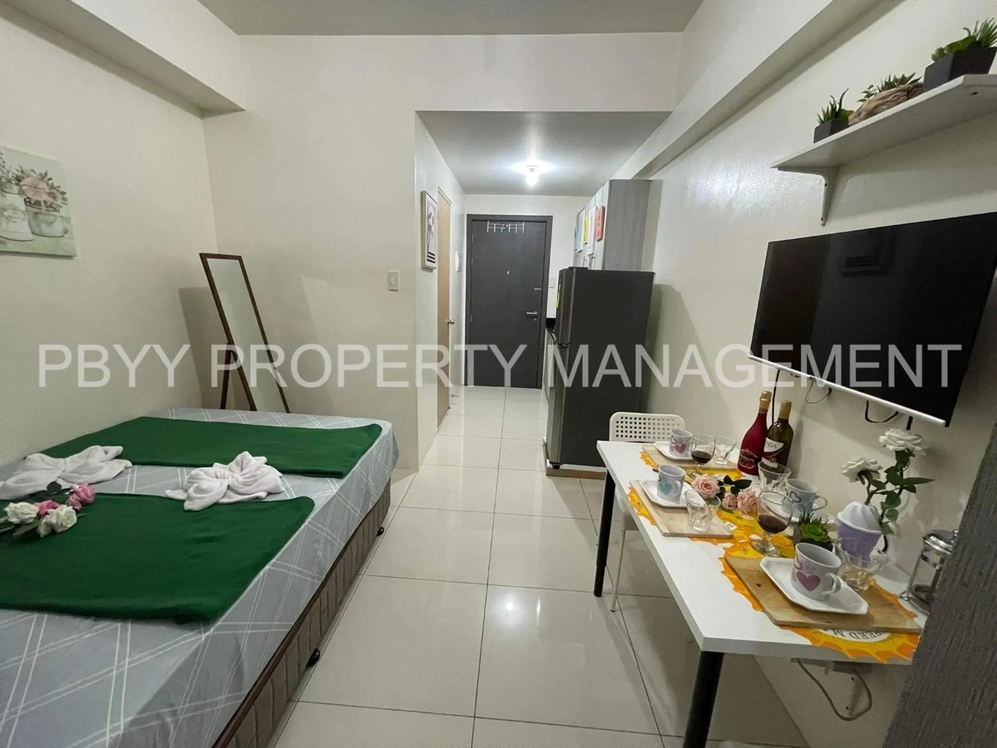 Bed in Green Residences Stays by PBYY