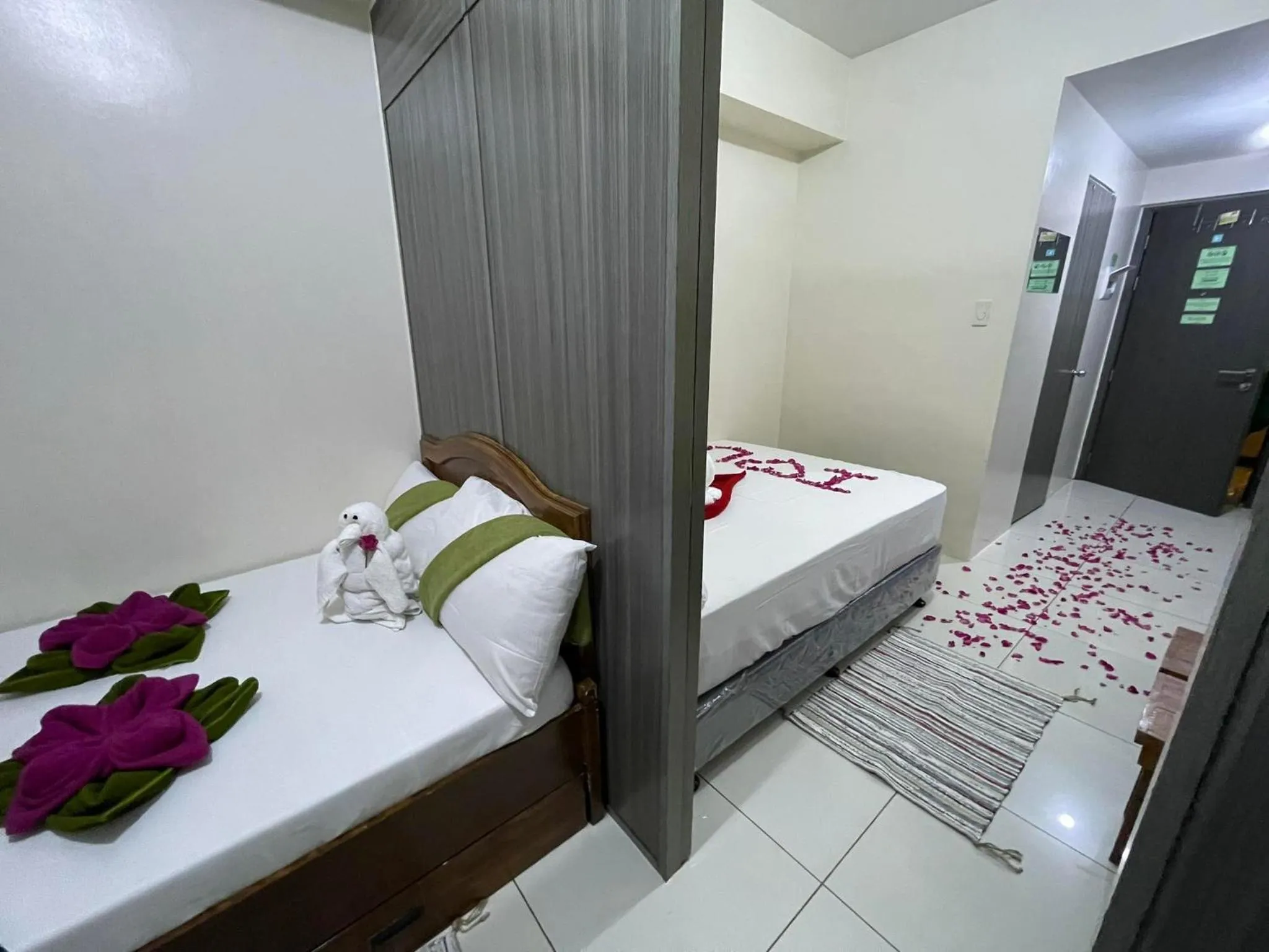 Bed in Green Residences Stays by PBYY