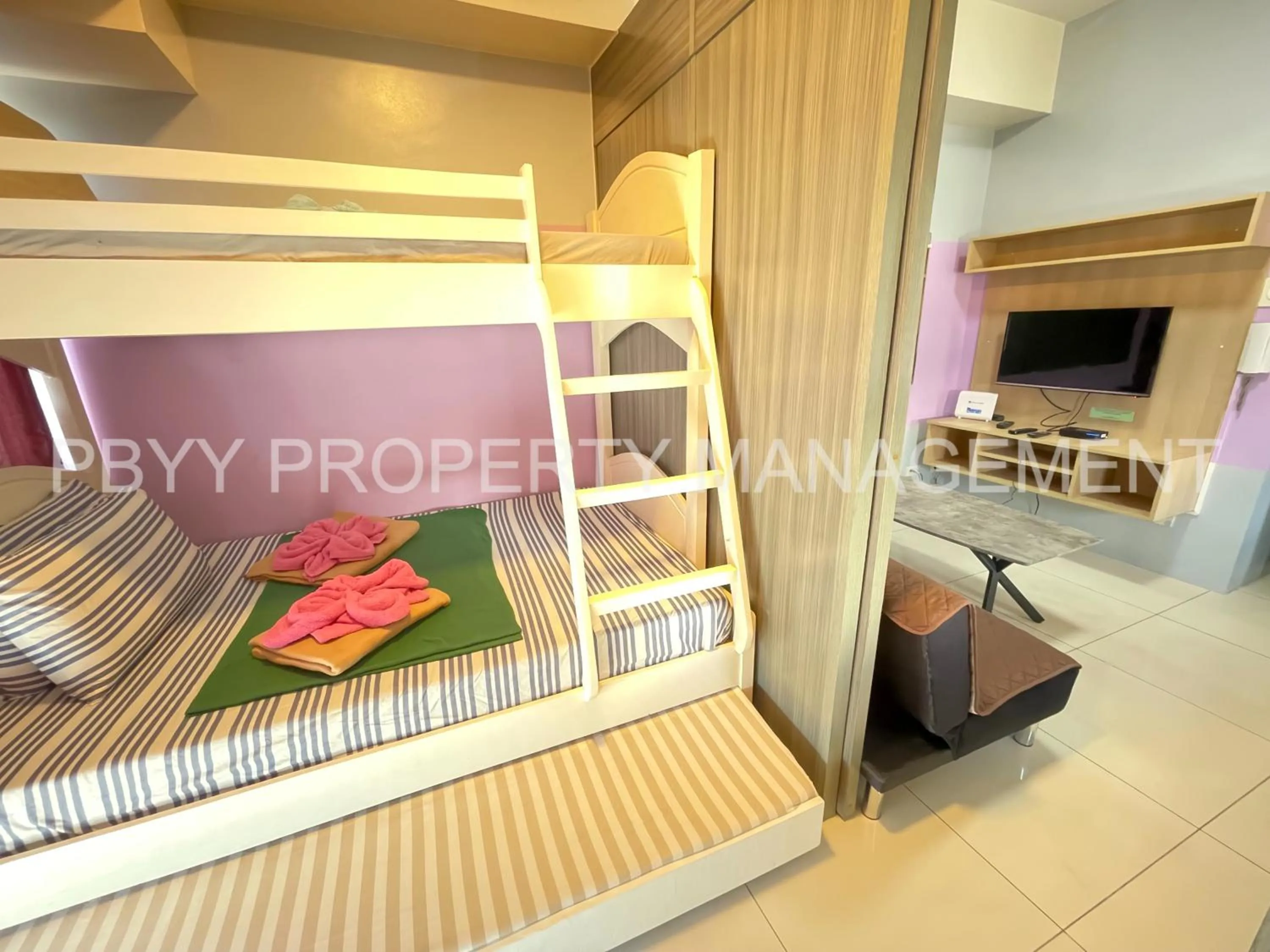 bunk bed in Green Residences Stays by PBYY