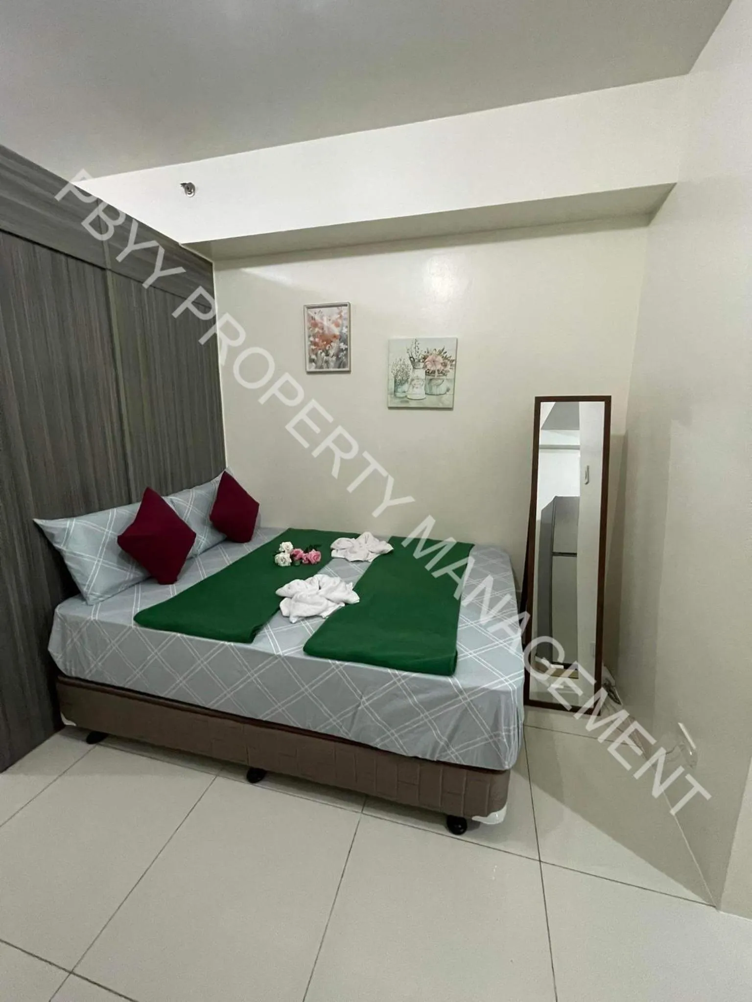 Bedroom in Green Residences Stays by PBYY