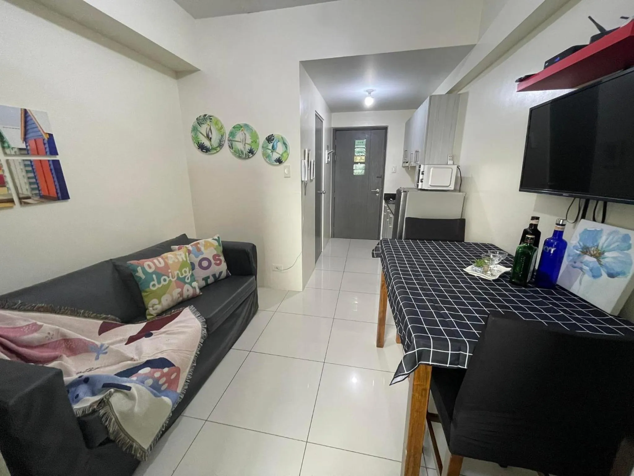 Bed, Seating Area in Green Residences Stays by PBYY