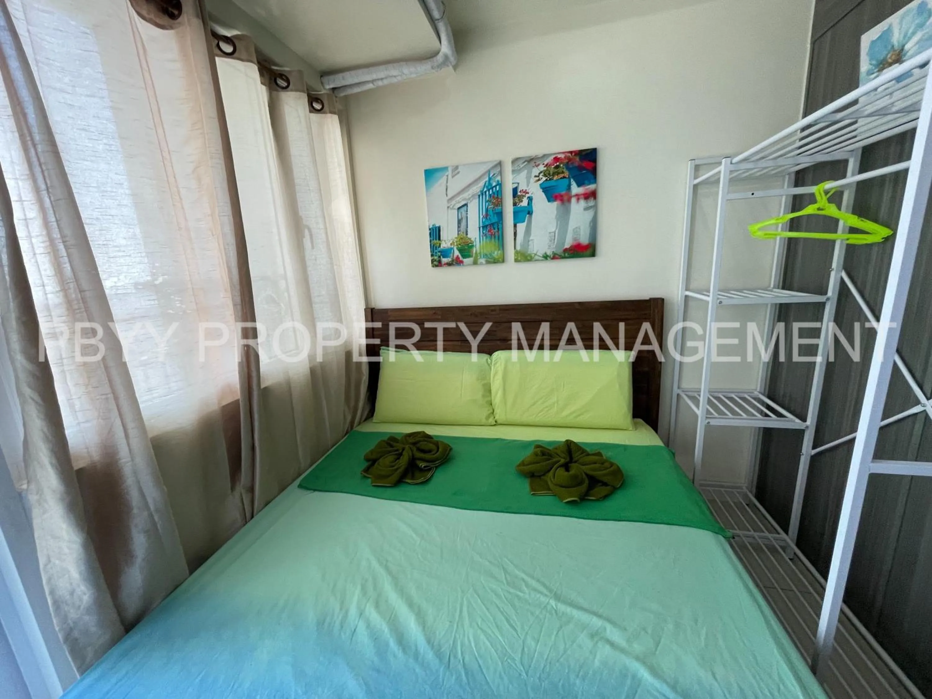 Bed in Green Residences Stays by PBYY