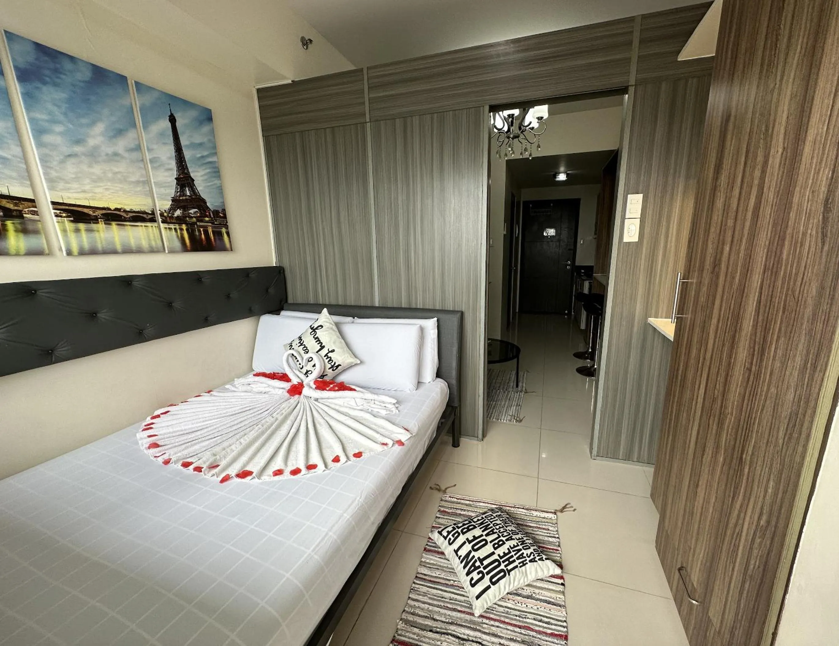 Bed, Seating Area in Green Residences Stays by PBYY