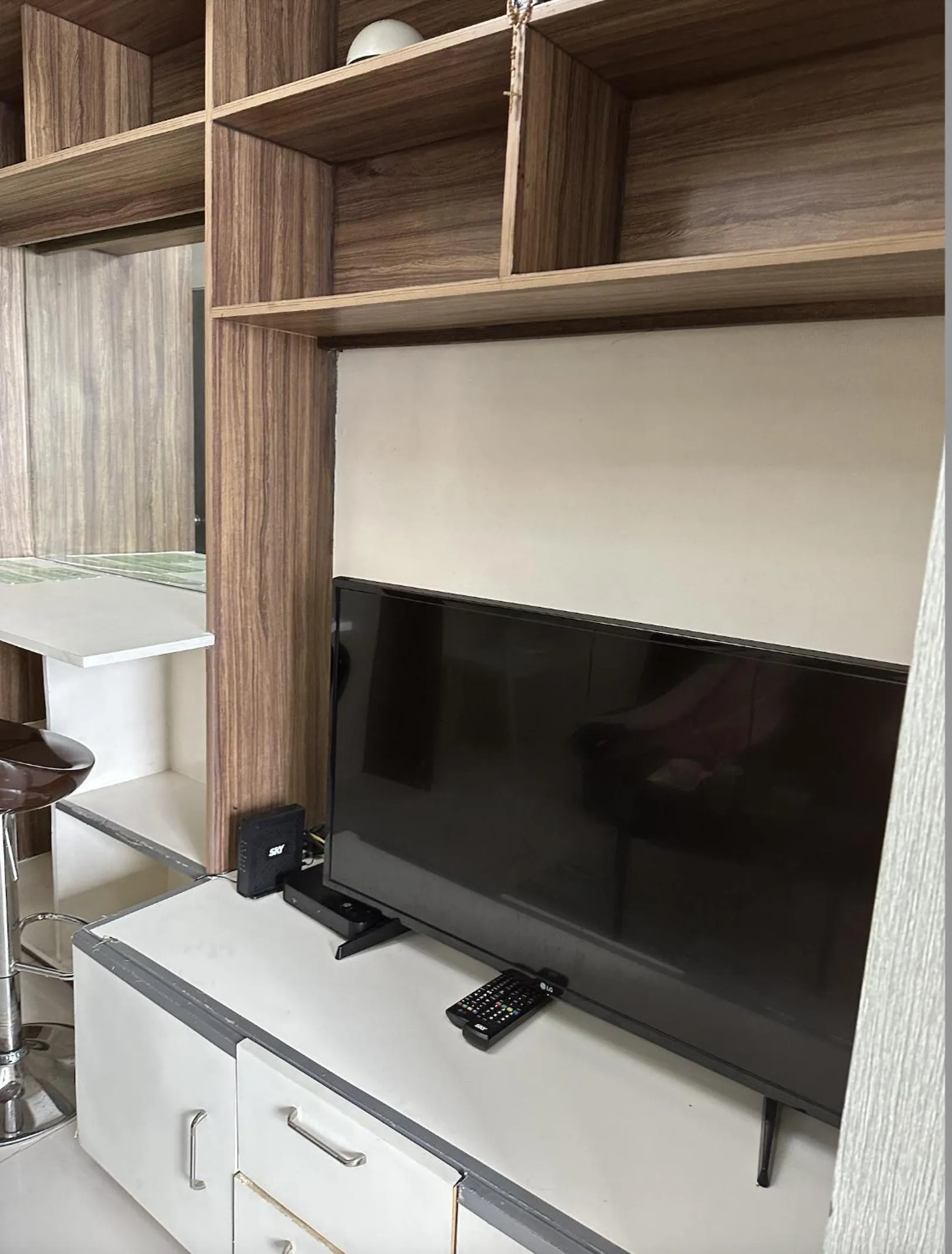 TV and multimedia, TV/Entertainment Center in Green Residences Stays by PBYY