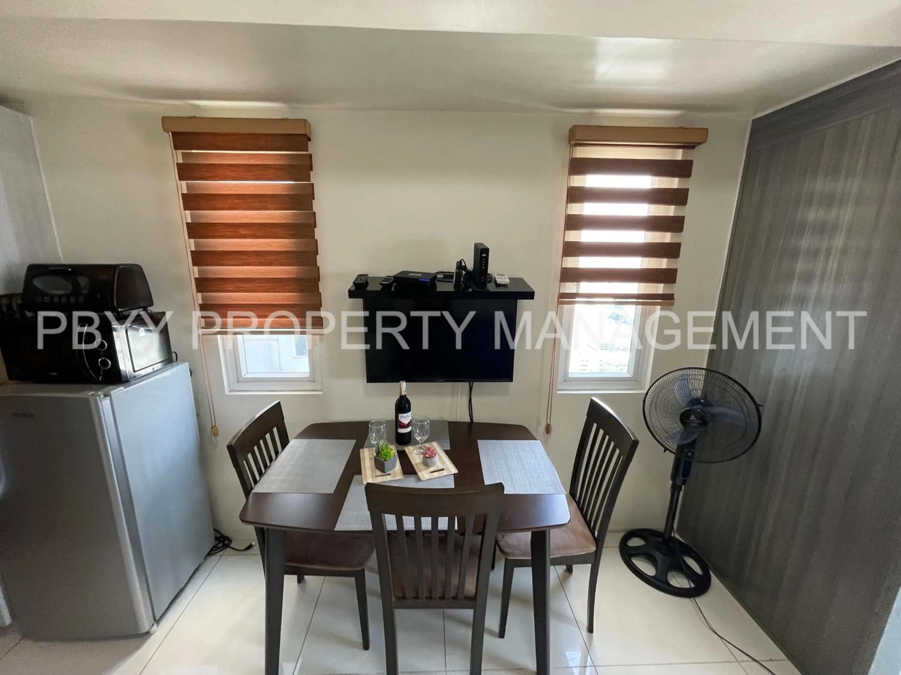 Dining Area in Green Residences Stays by PBYY