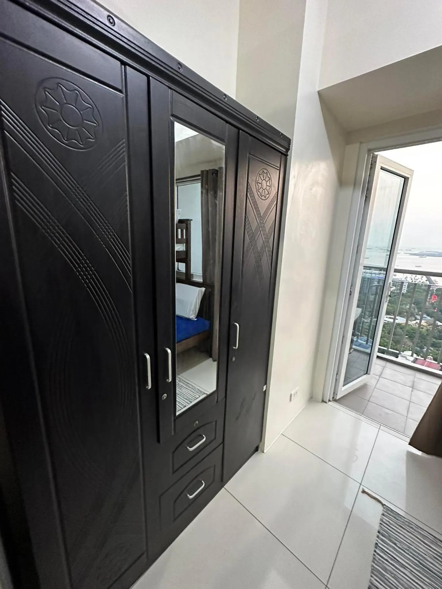 wardrobe in Green Residences Stays by PBYY