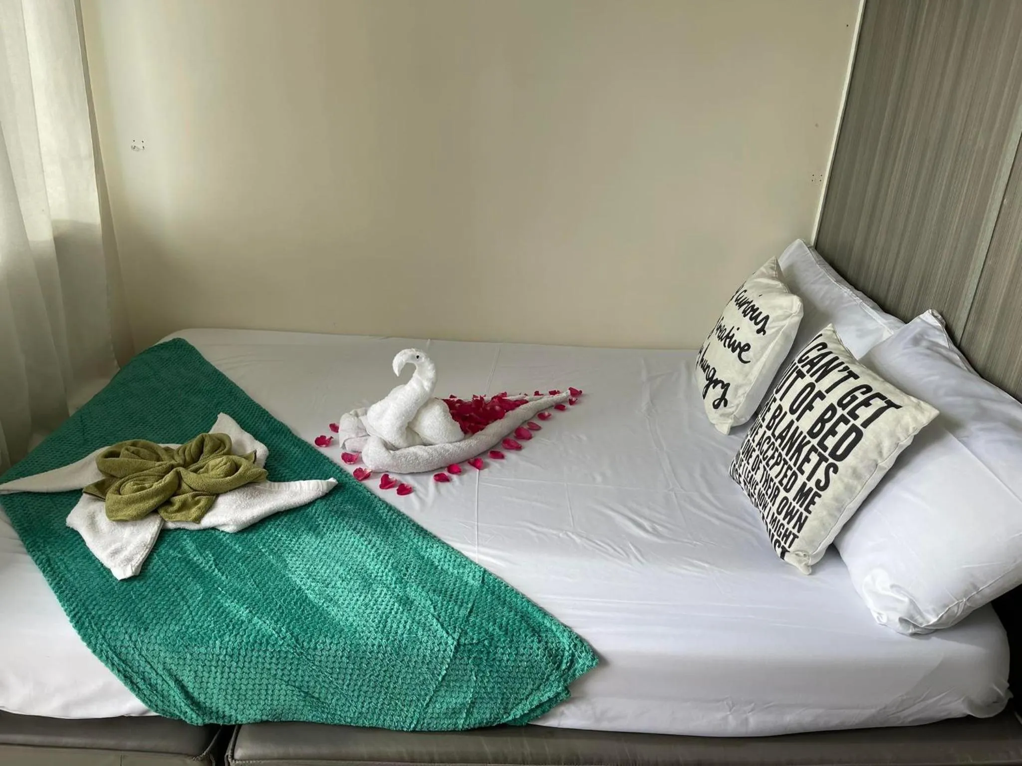 Bed in Green Residences Stays by PBYY