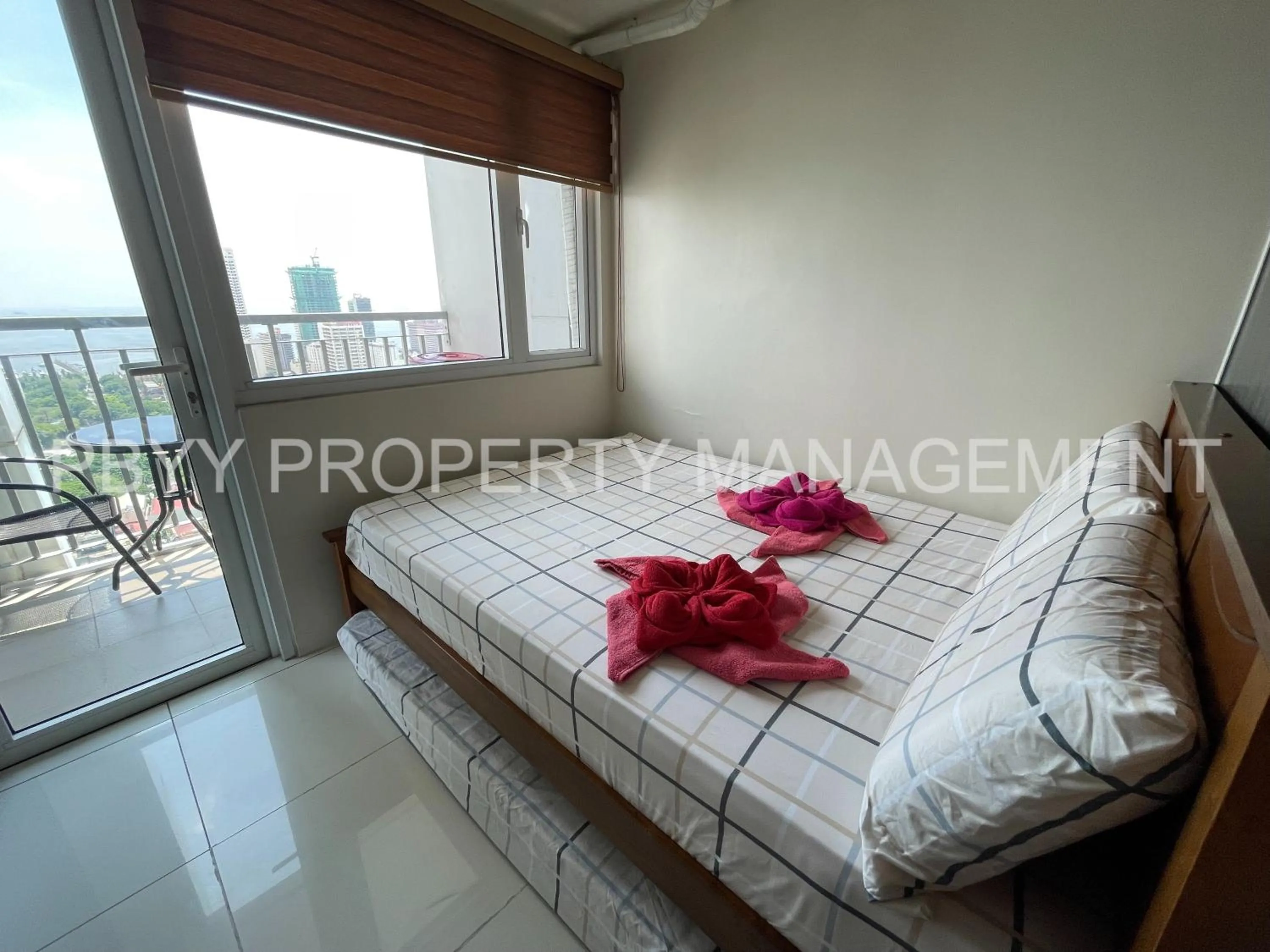 Bed in Green Residences Stays by PBYY