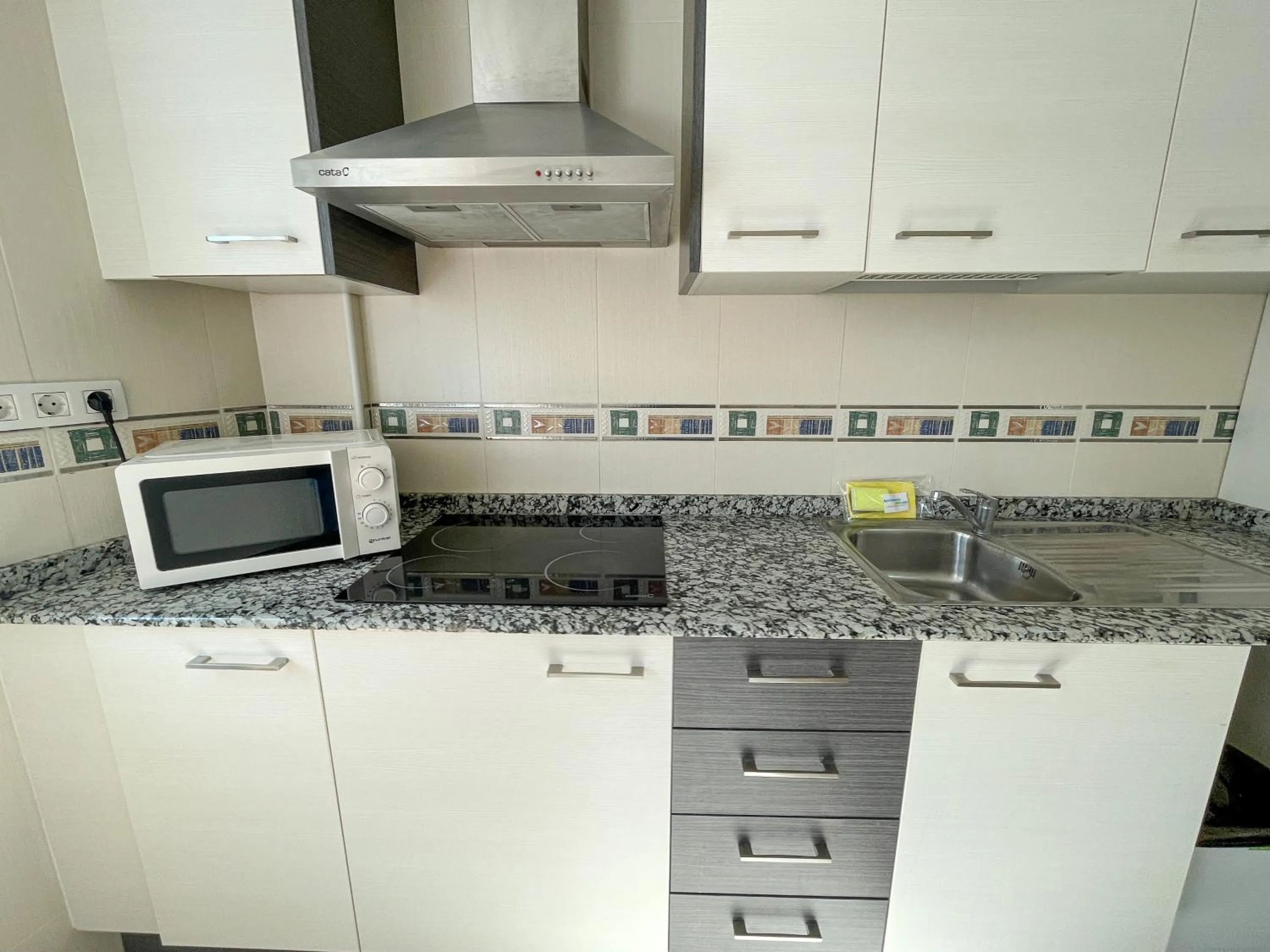 Kitchen or kitchenette in Apartamentos Neptuno 3000