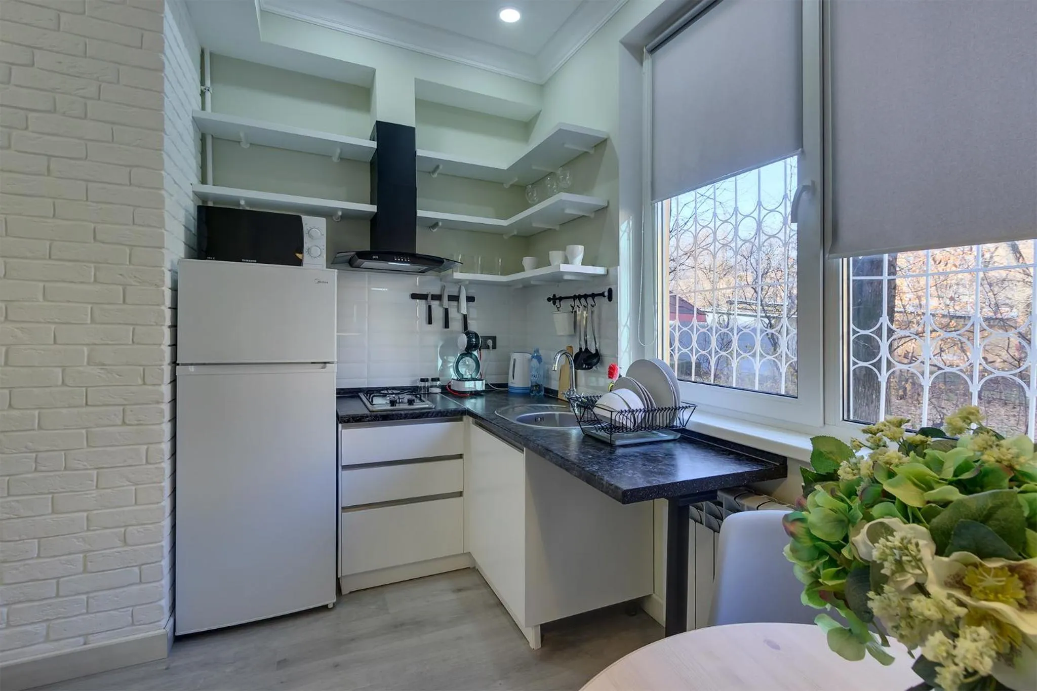 Kitchen or kitchenette in Opera Apartments Almaty