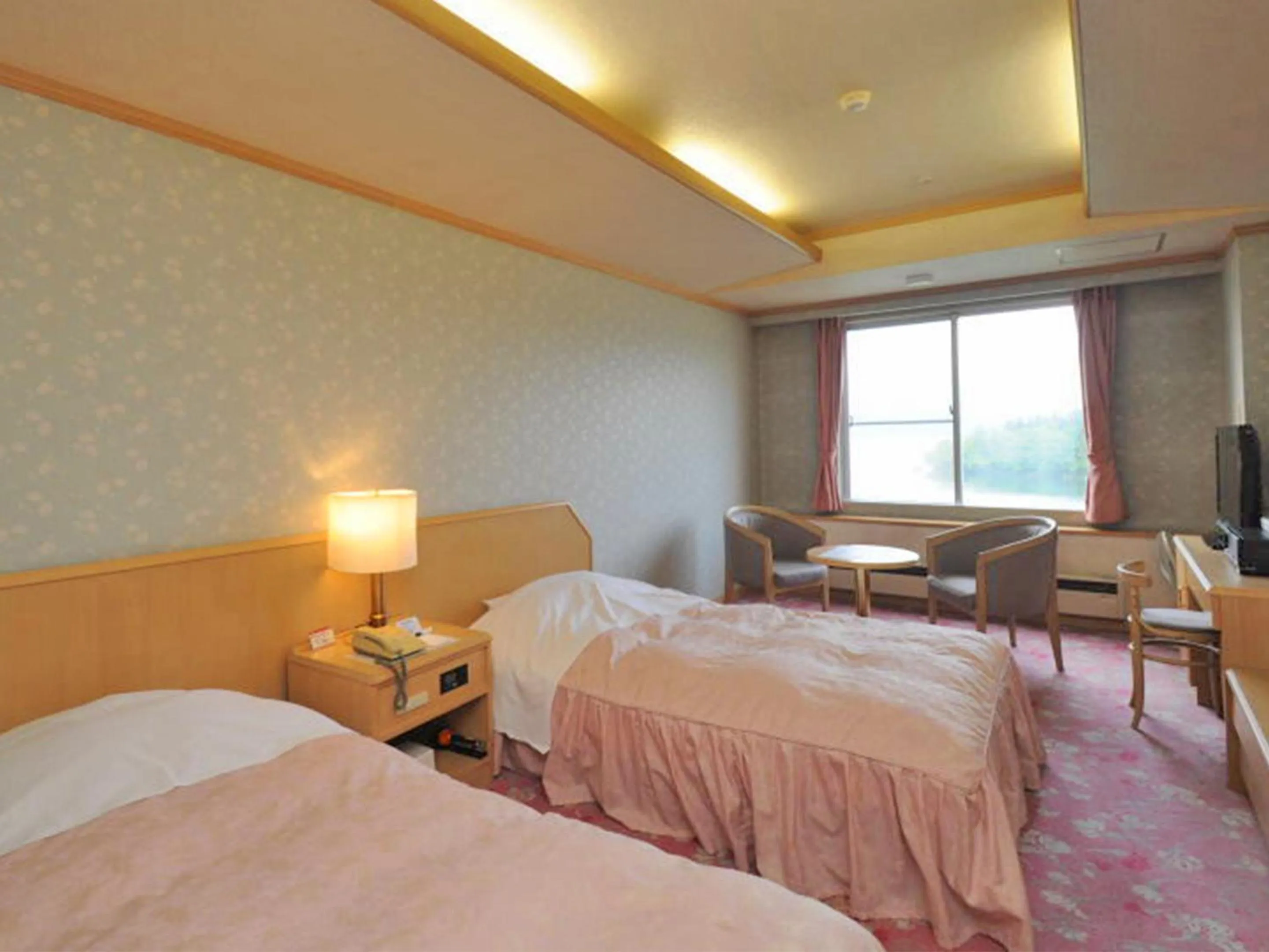 Photo of the whole room, Bed in New Akan Hotel