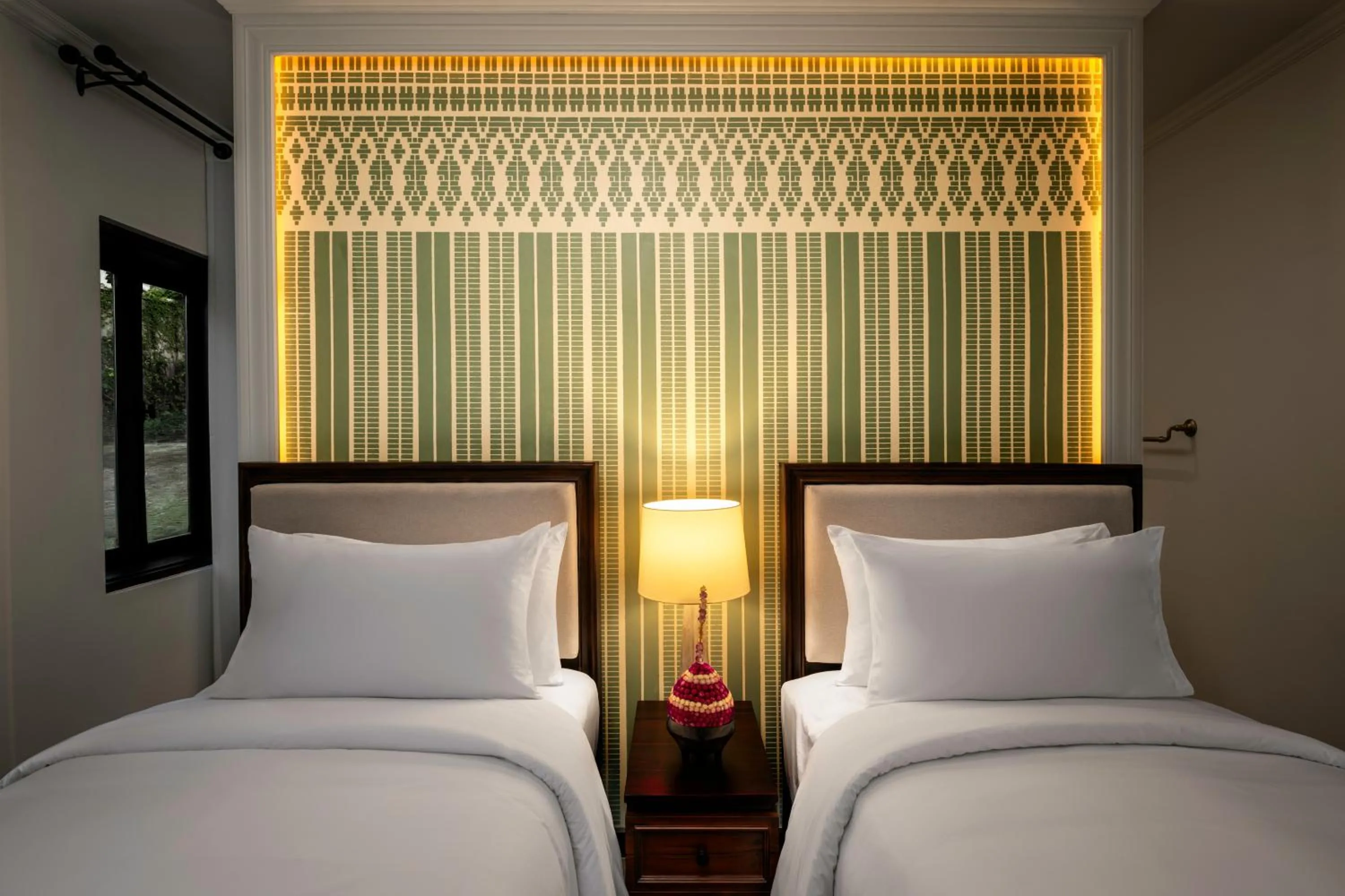 Bed in Hotel Kiridara Luang Prabang