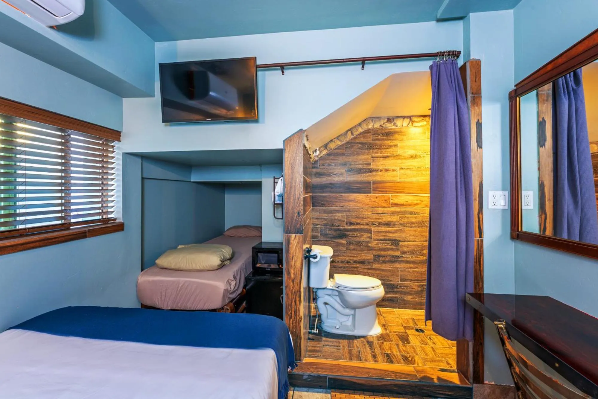 Toilet, Bed in Nomads Hotel