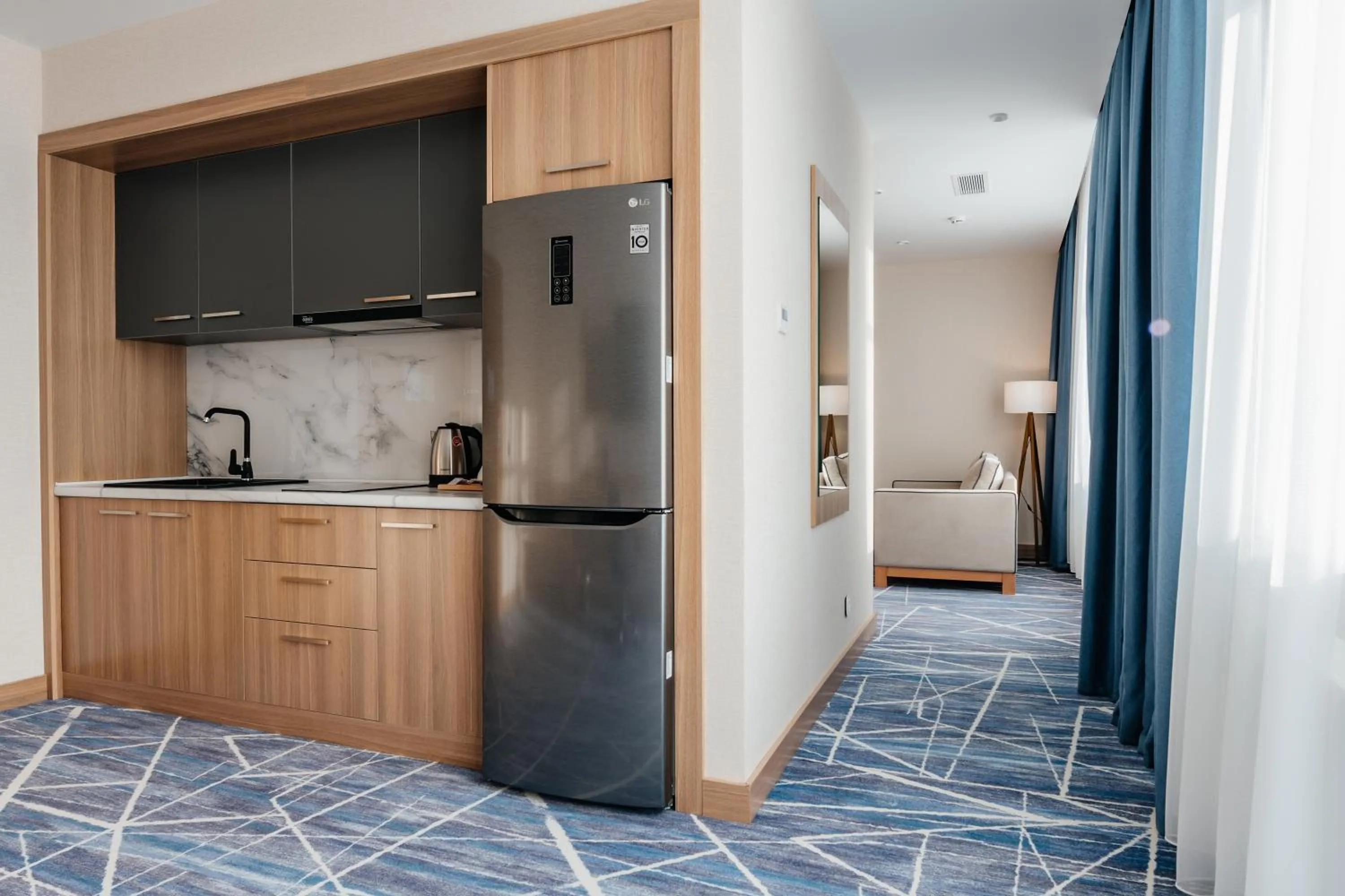 Kitchen or kitchenette in Ramada by Wyndham Astana