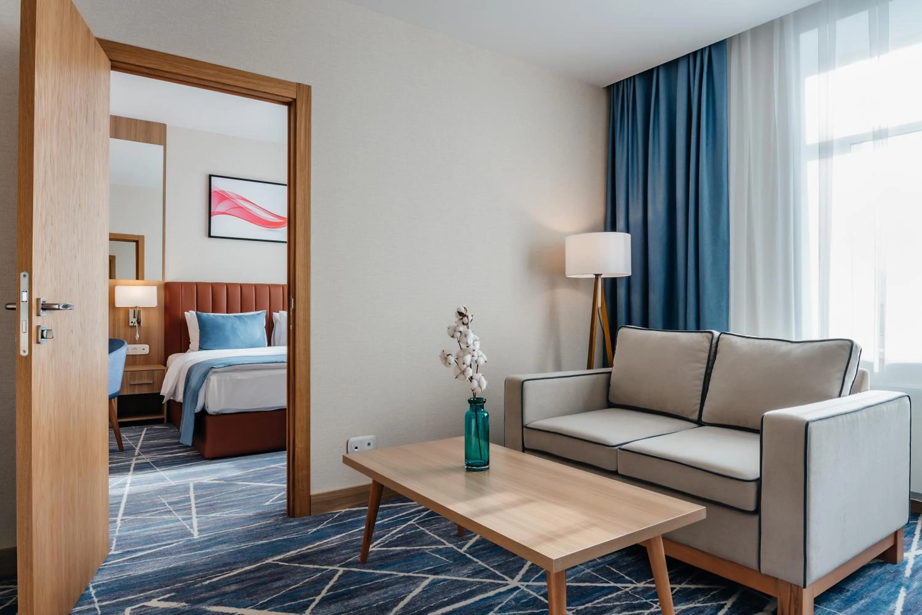 Living room, Bed in Ramada by Wyndham Astana