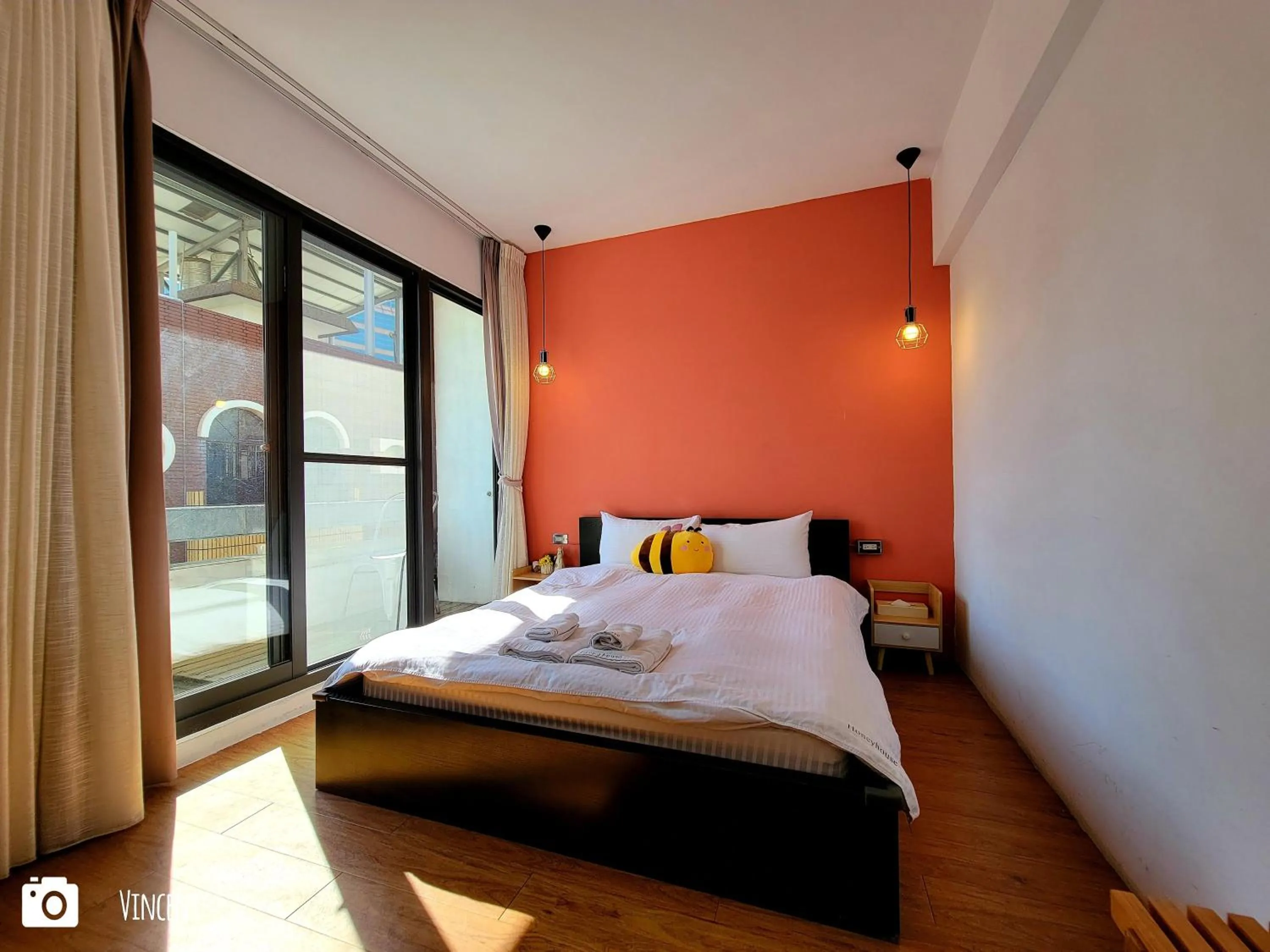 Photo of the whole room, Bed in Honey House Tainan