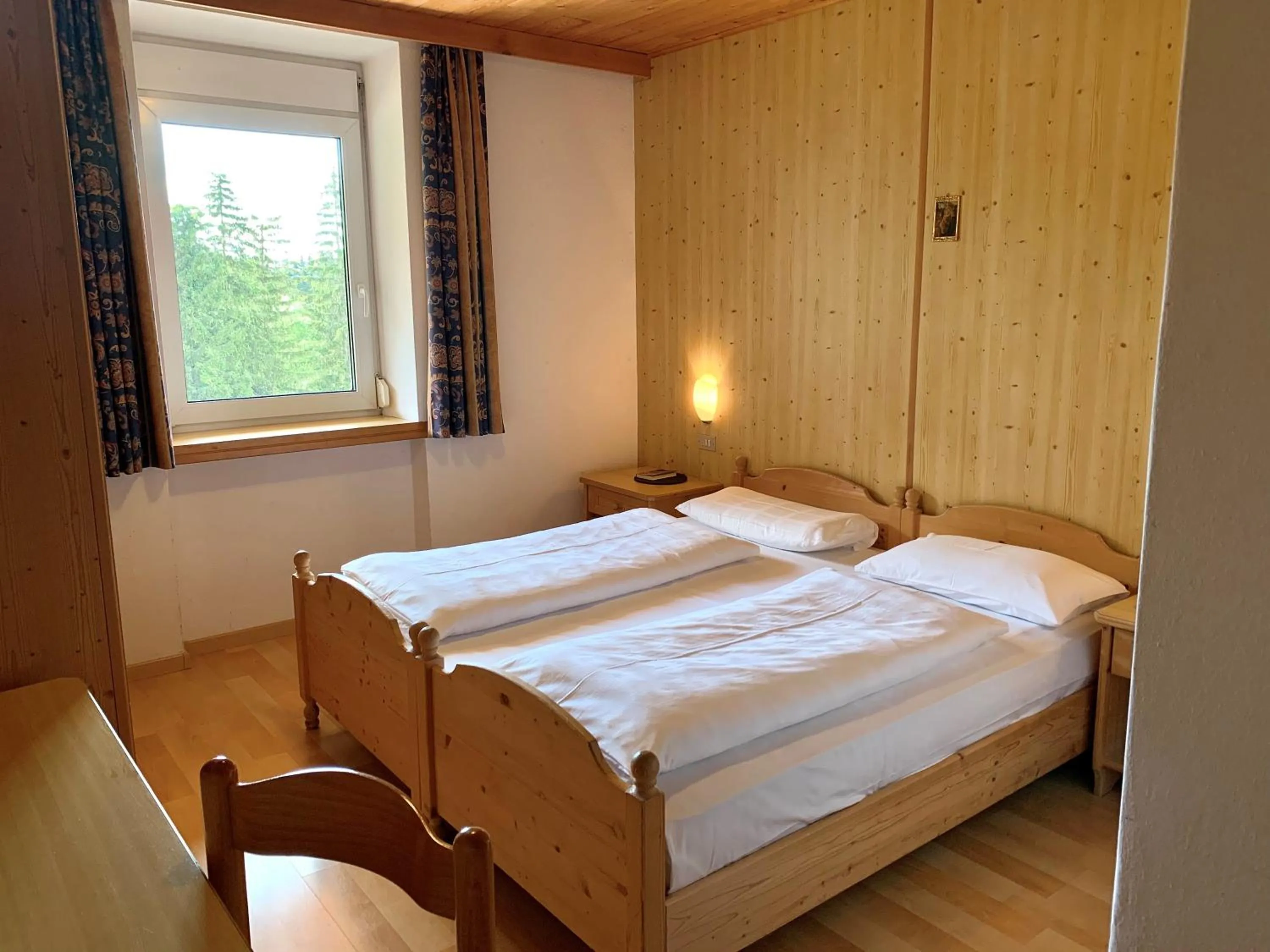 Bed in Apparthotel Germania