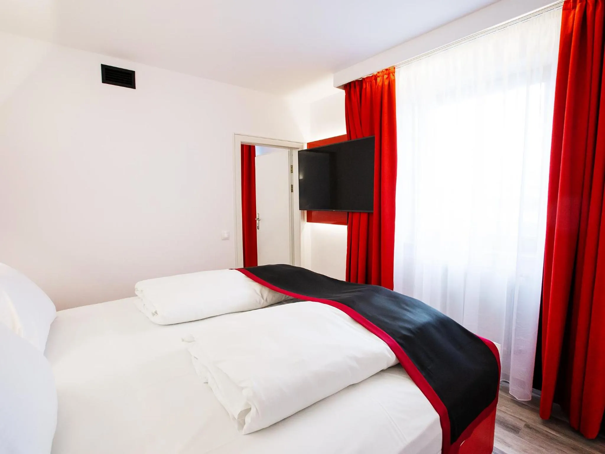 Photo of the whole room, Bed in DORMERO Hotel Burghausen