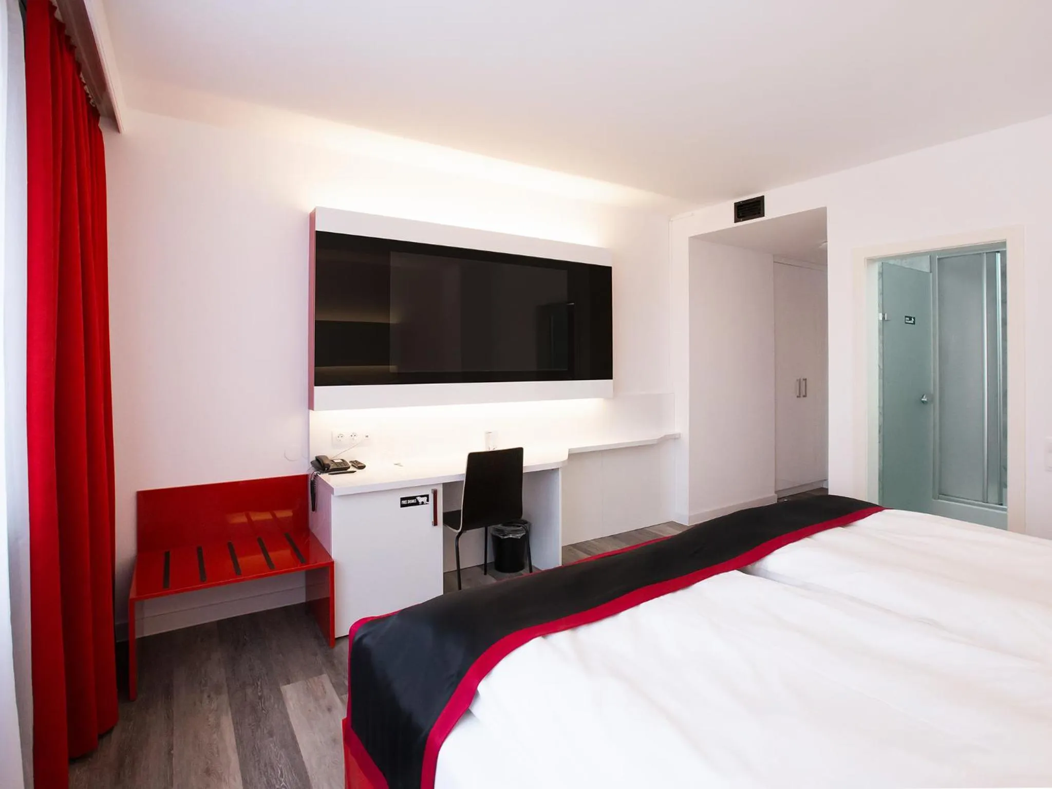 Photo of the whole room, Bed in DORMERO Hotel Burghausen