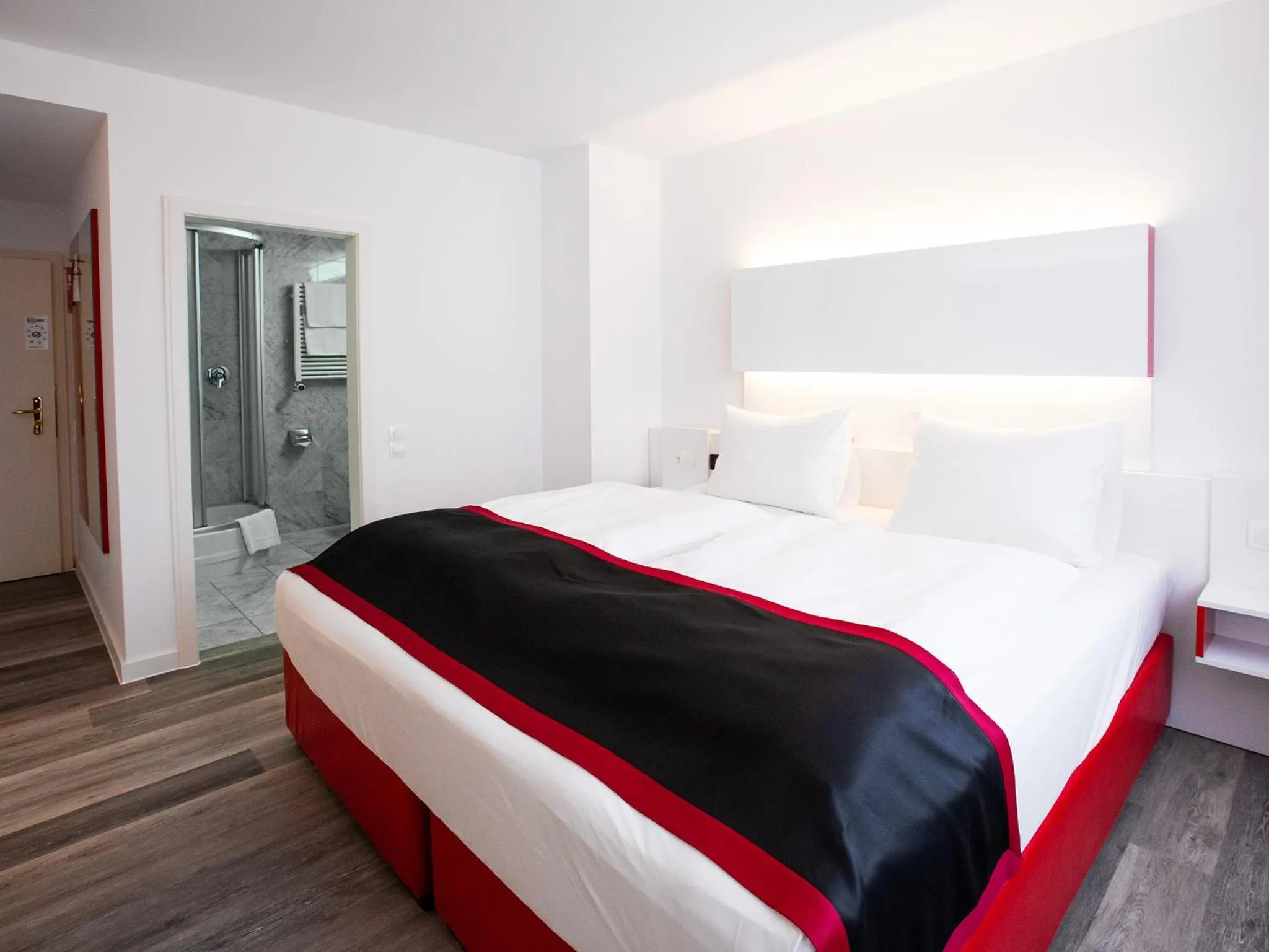 Photo of the whole room, Bed in DORMERO Hotel Burghausen