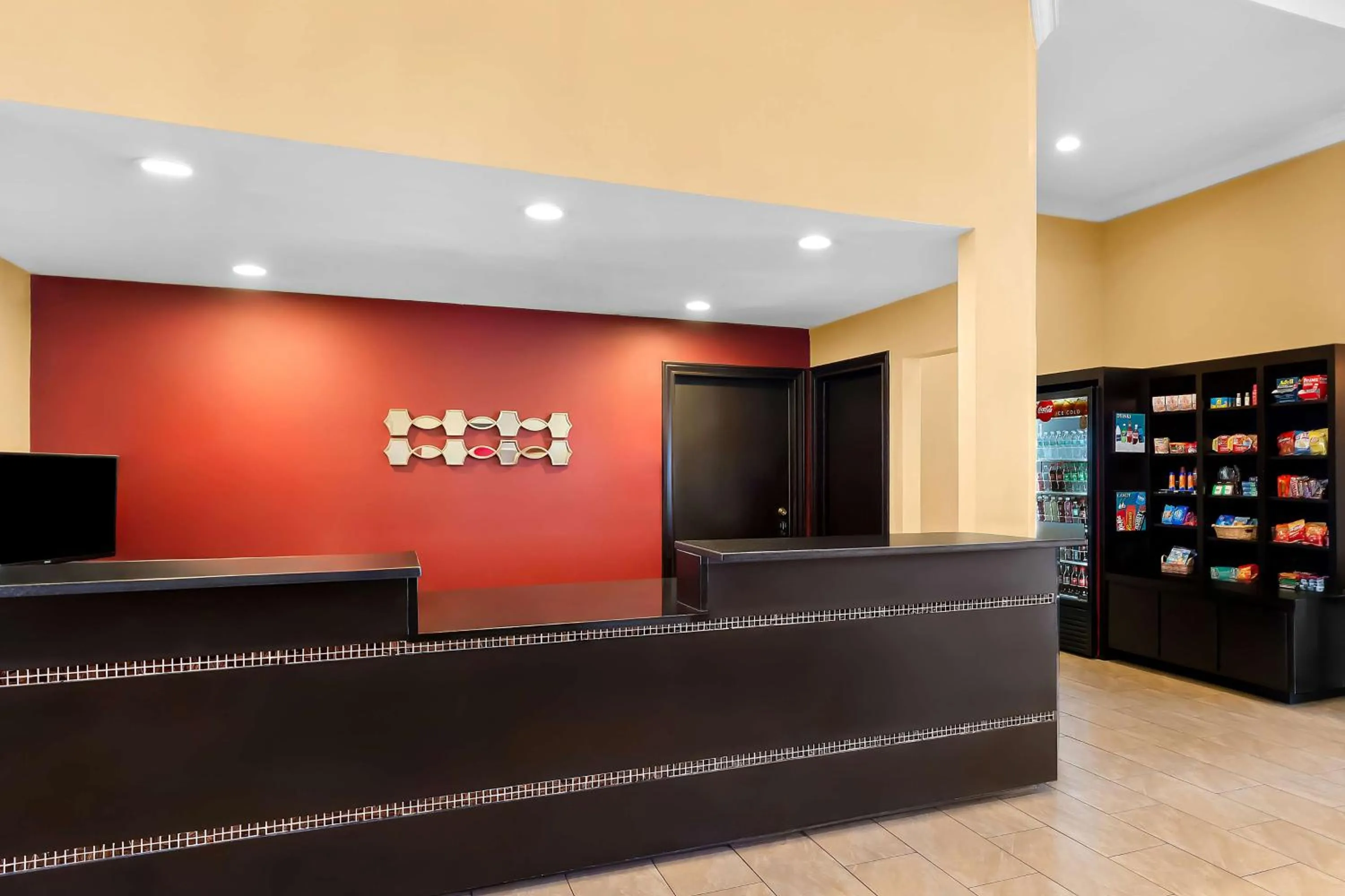 Lobby or reception in SureStay Plus by Best Western San Antonio Fiesta Inn
