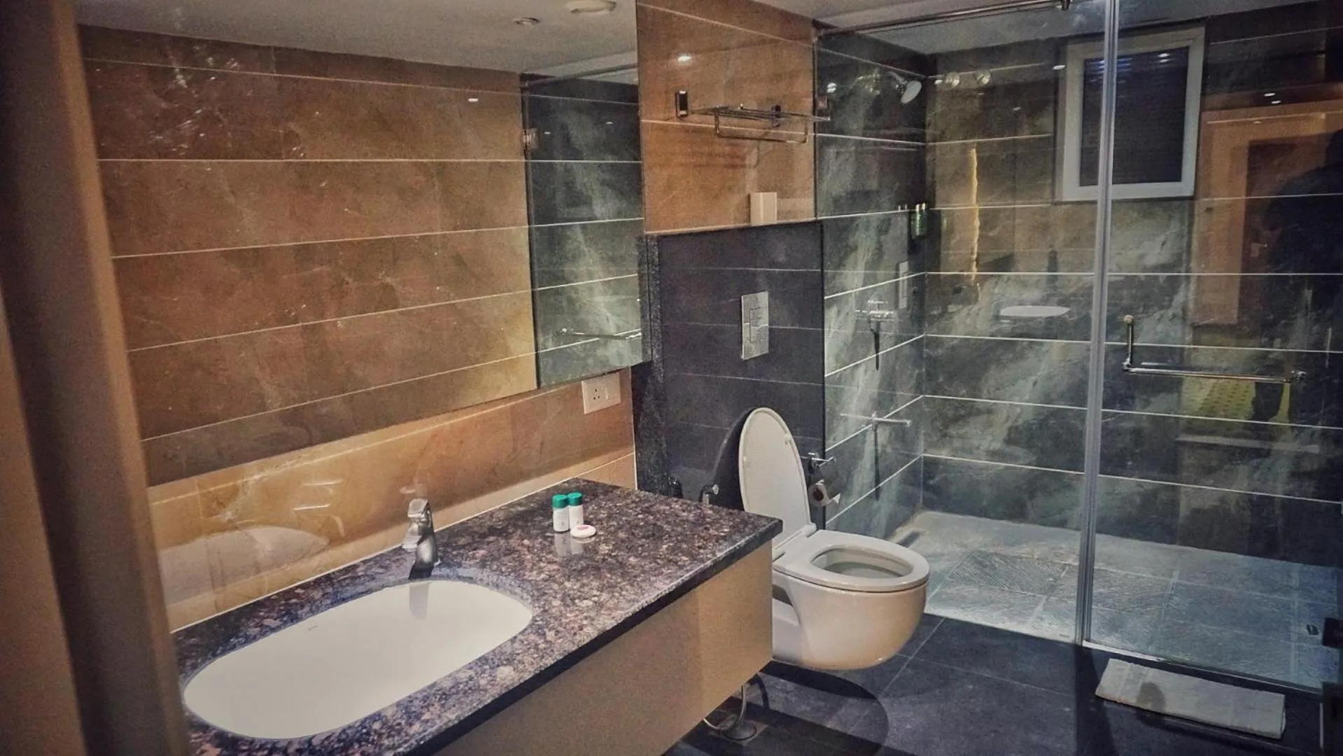 Bathroom in Kyriad Hotel Gulbarga by OTHPL