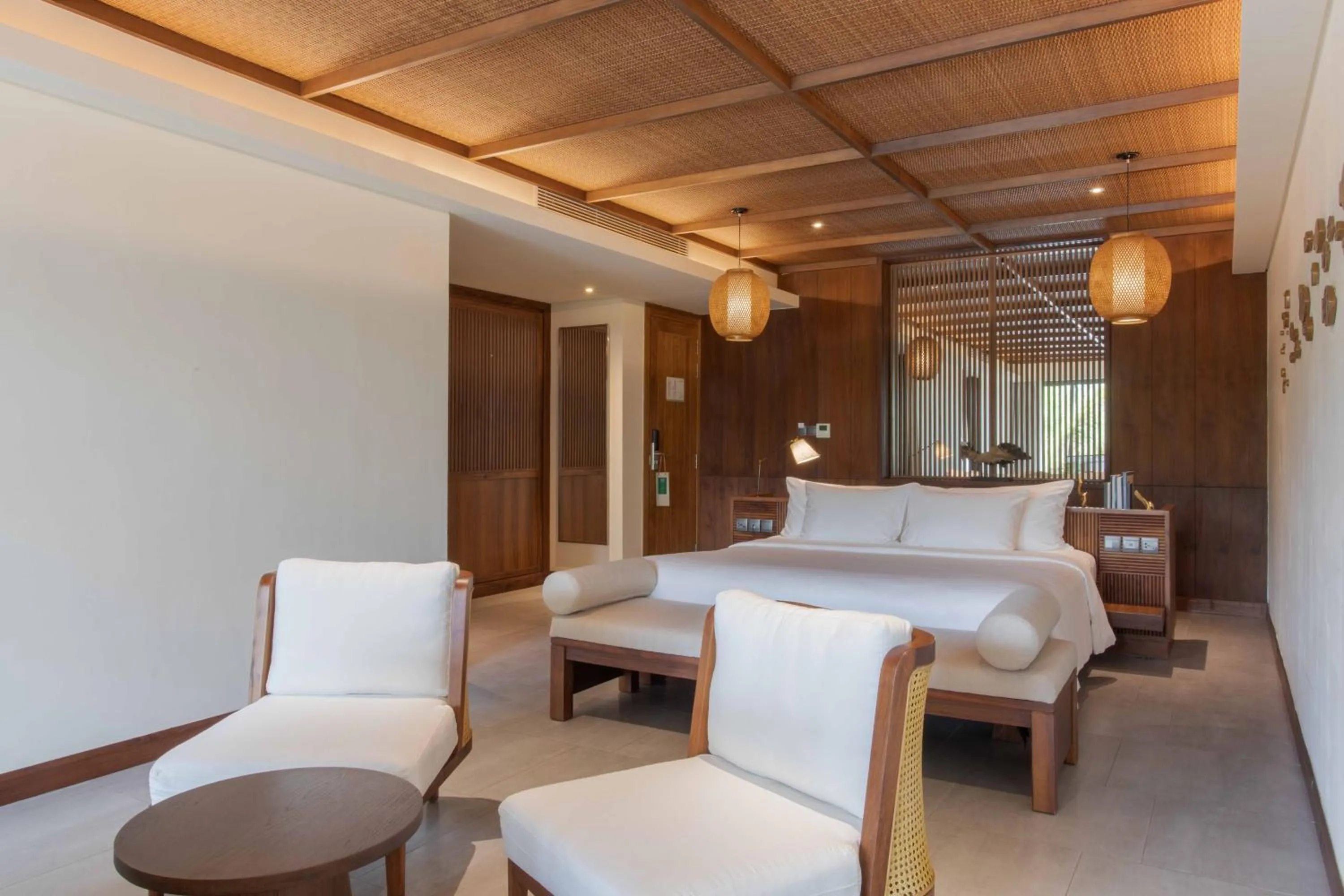 Seating area, Bed in Dusit Princess Moonrise Beach Resort