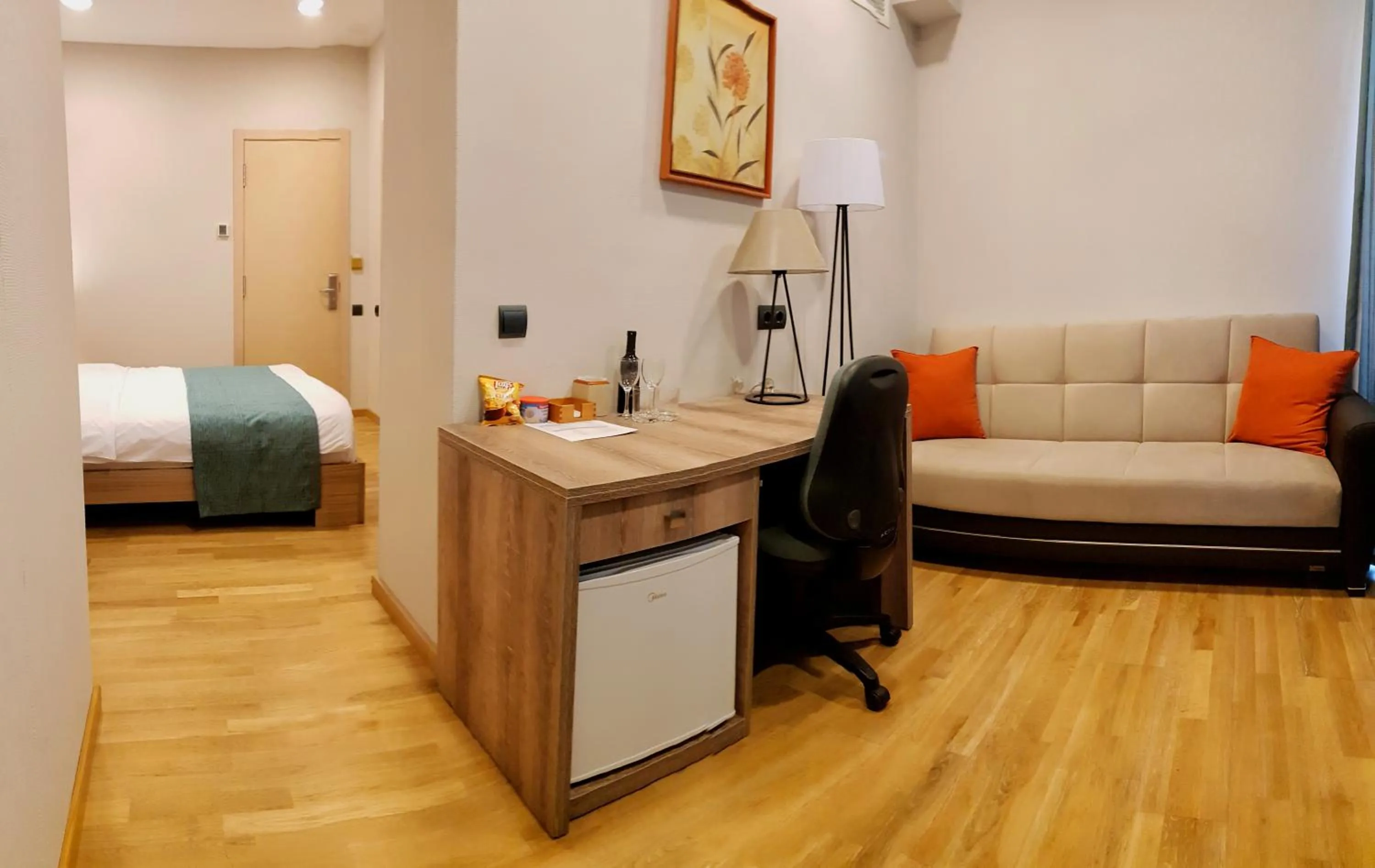 Seating area, Bed in Maison Boutique Hotel