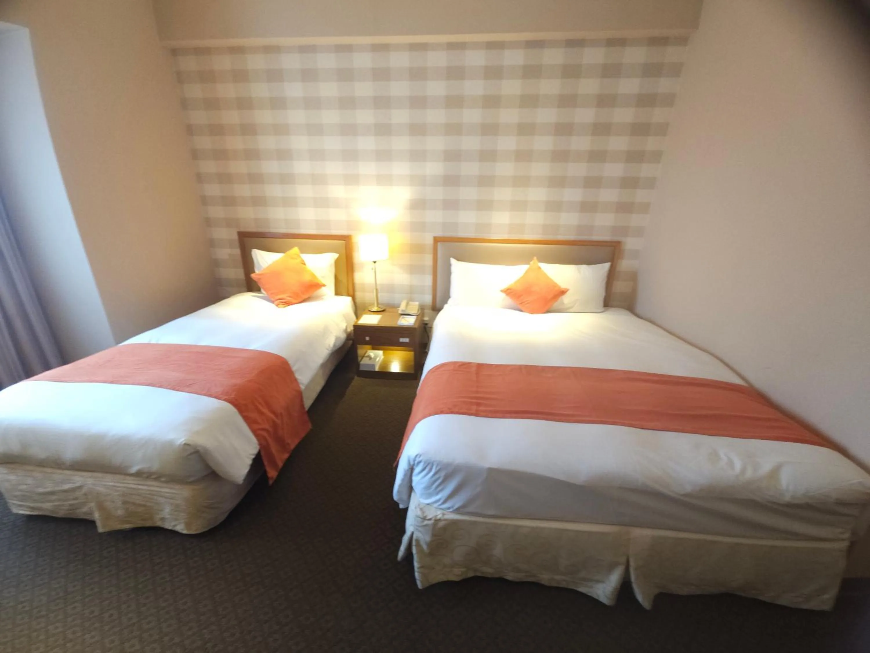 Bed in Hotel Riverview Taipei