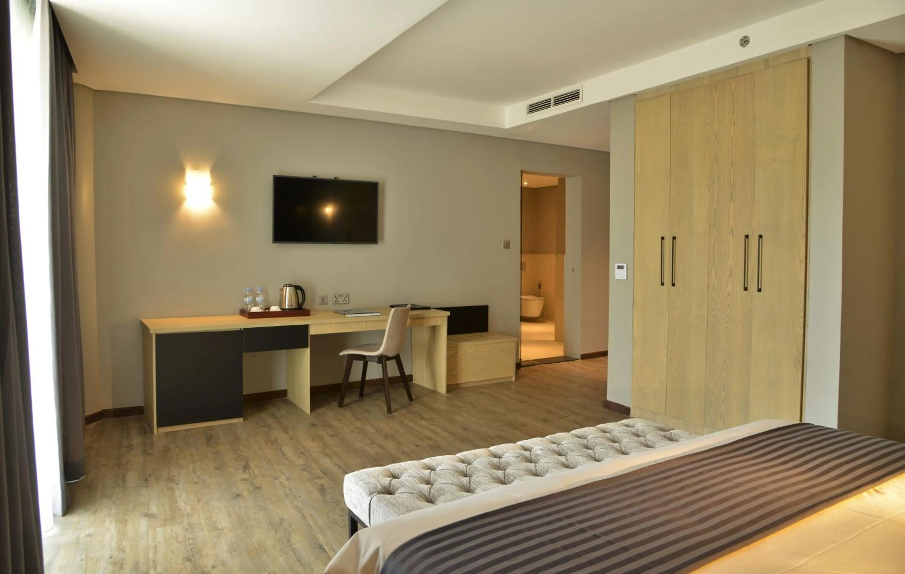 Photo of the whole room, Bed in EPIC Hotel & Suites