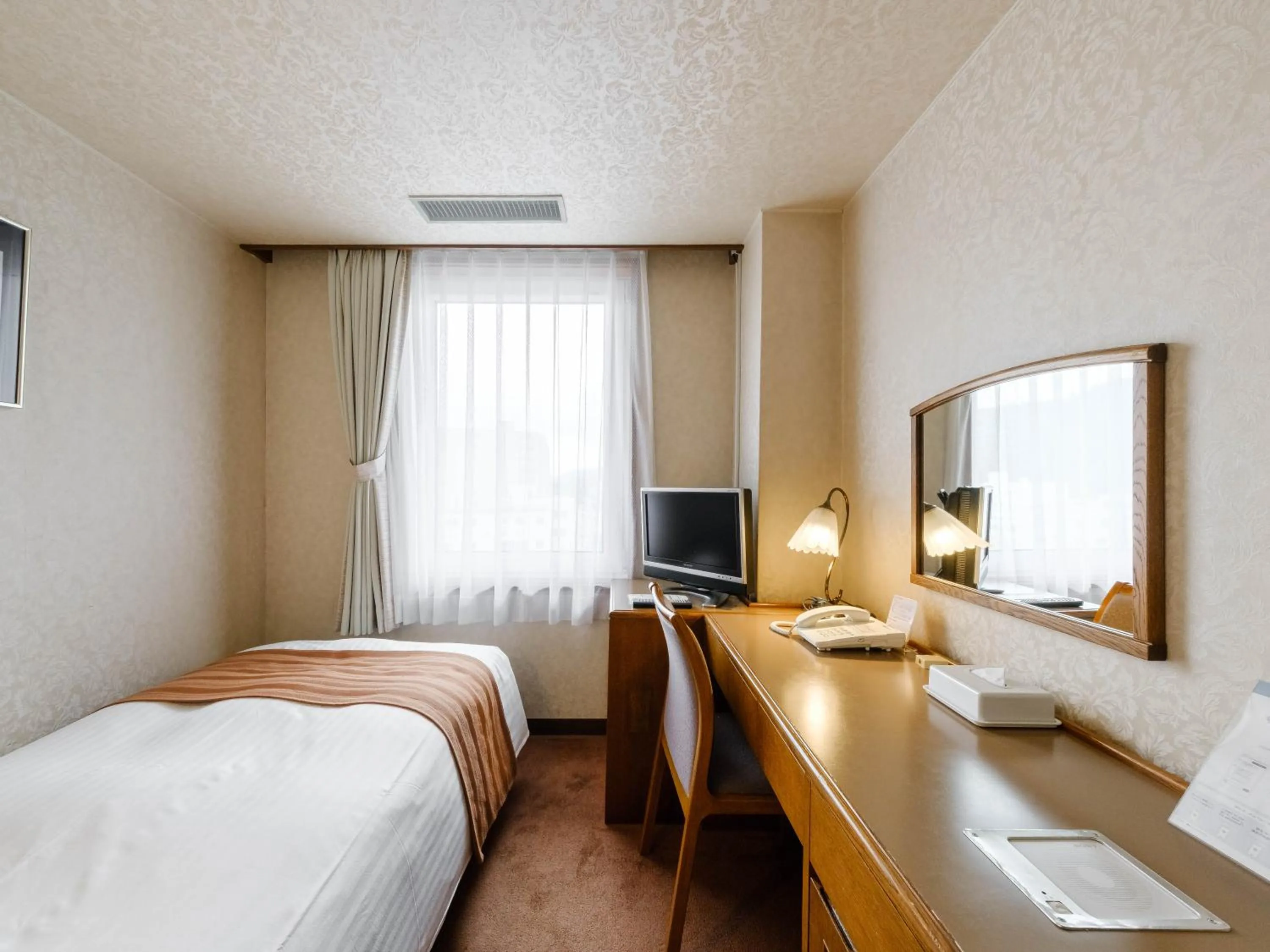 Bed in Tabist Abashiri Central Hotel