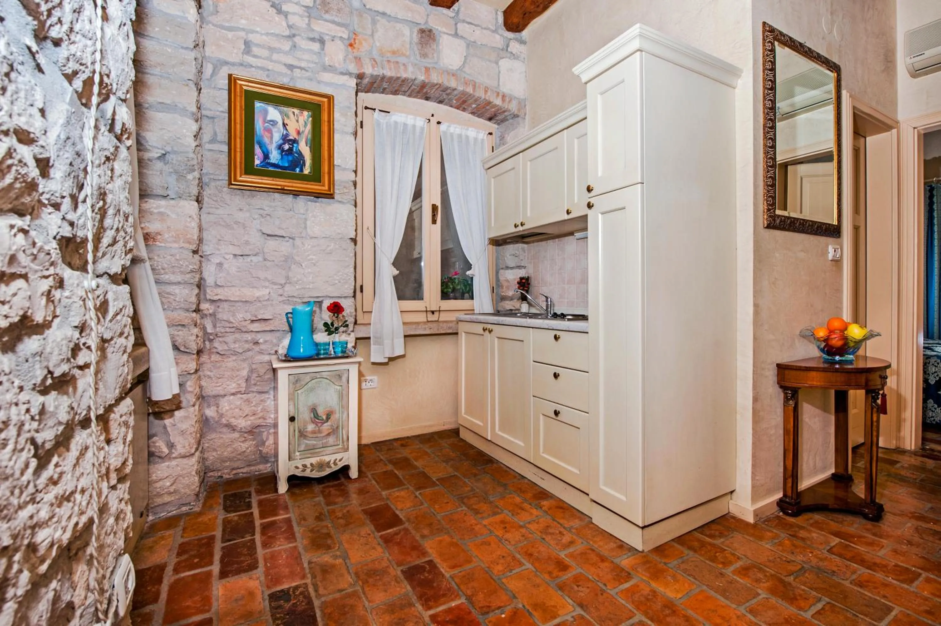 Kitchen or kitchenette in Residence PORTA ANTICA Centro Storico