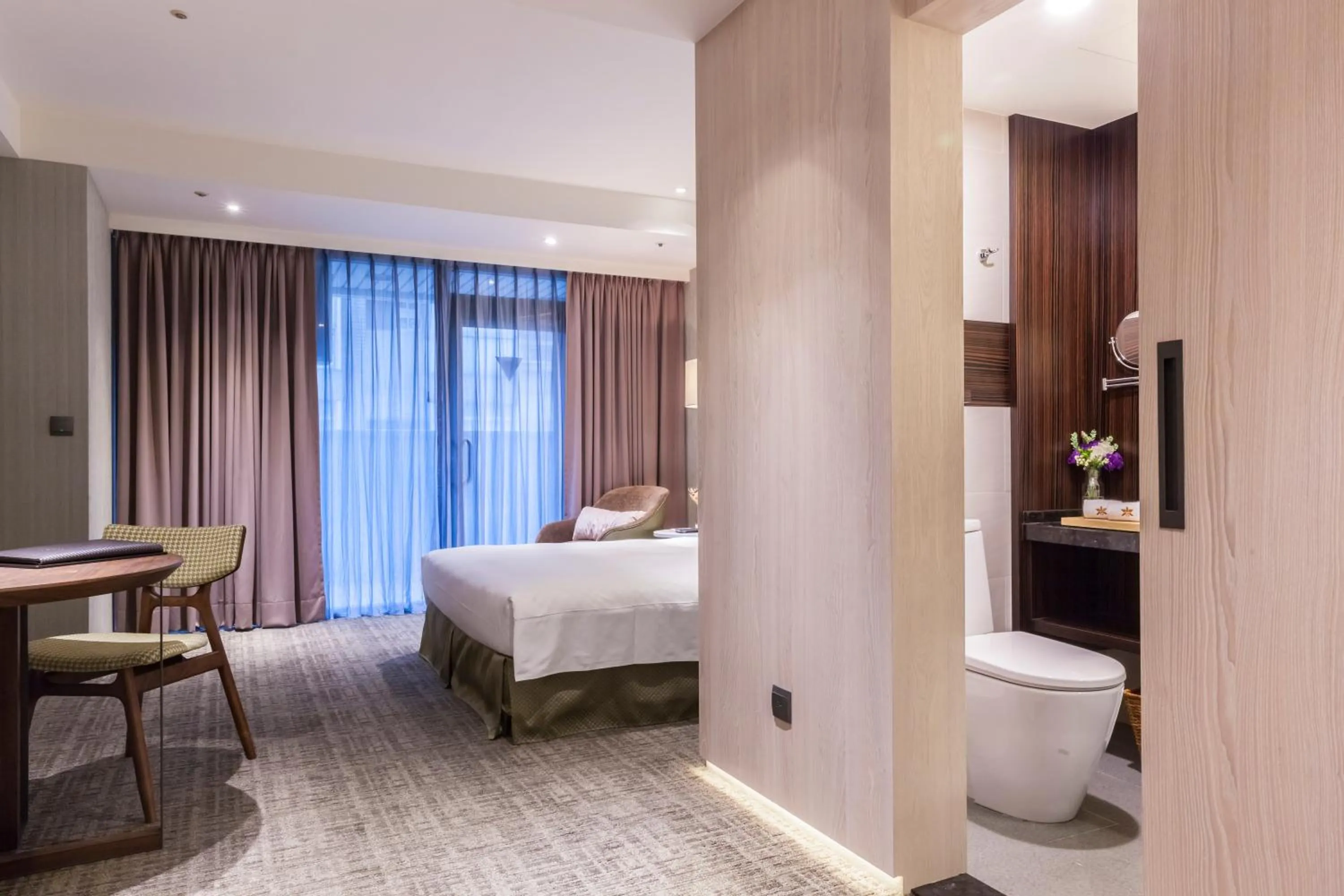 Bed in Pacific Business Hotel