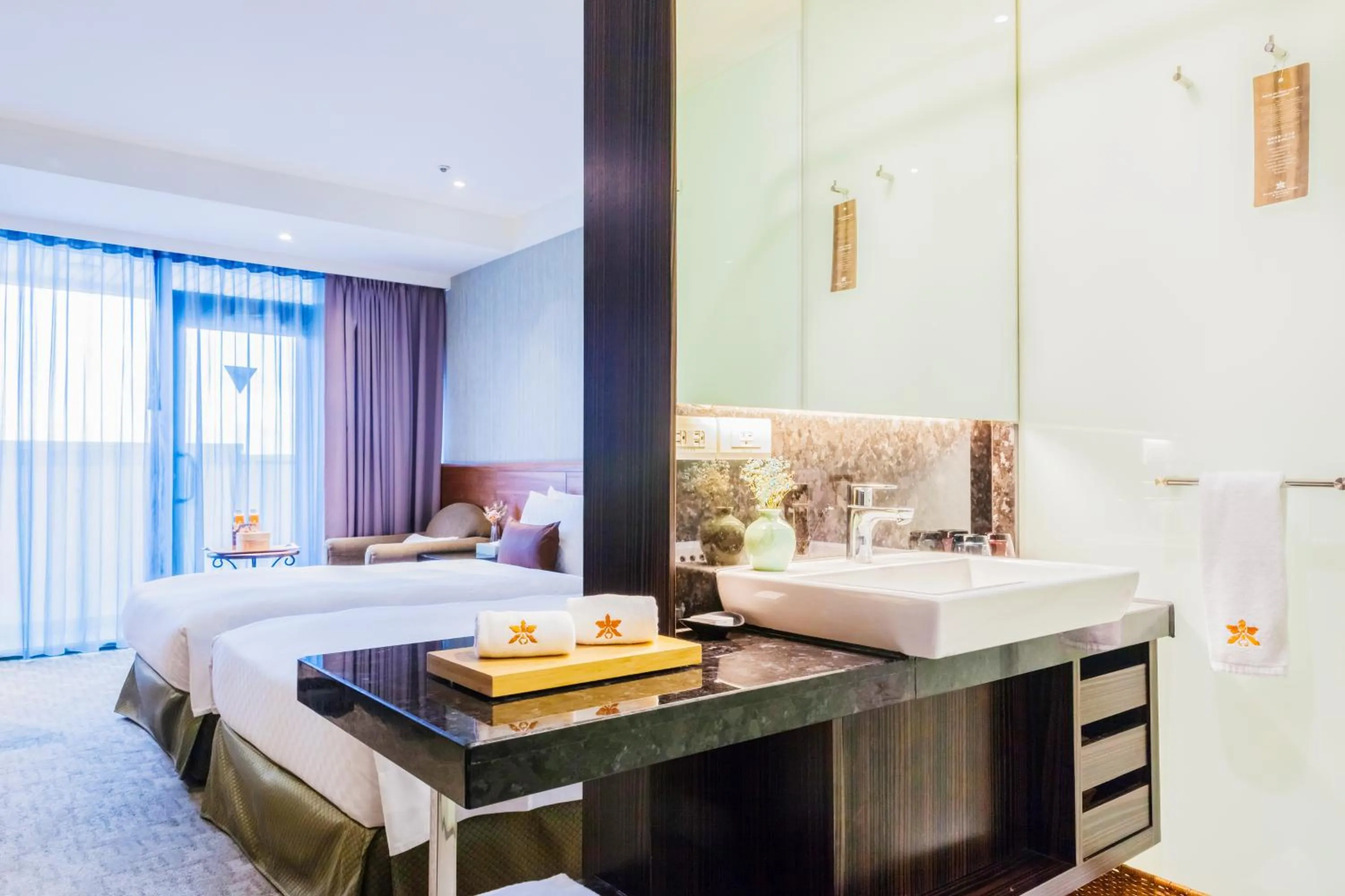 Bed in Pacific Business Hotel