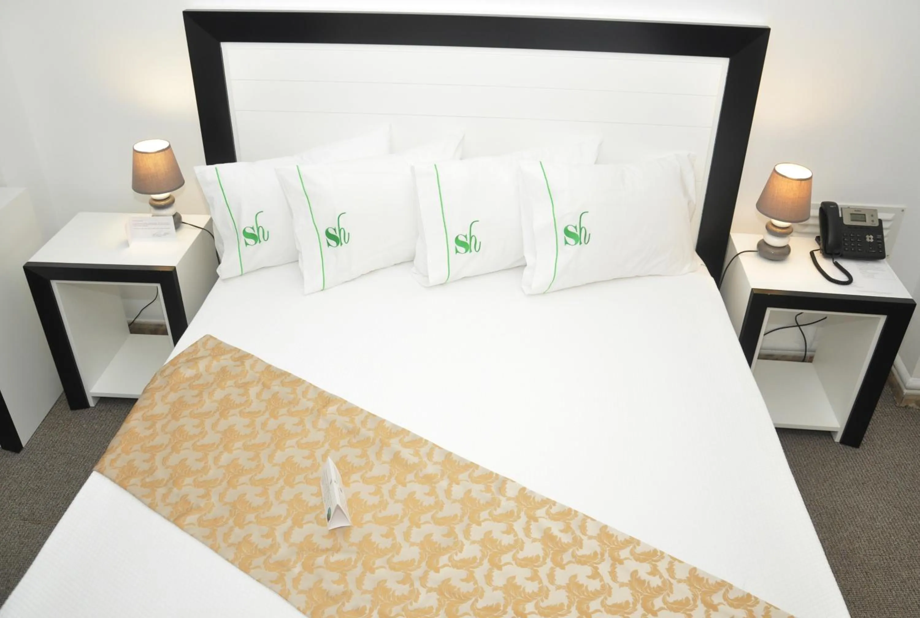 Bed in SH Boutique Hotel