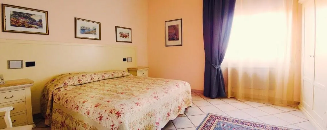 Bedroom in Hotel Ristorante Vecchia Maremma