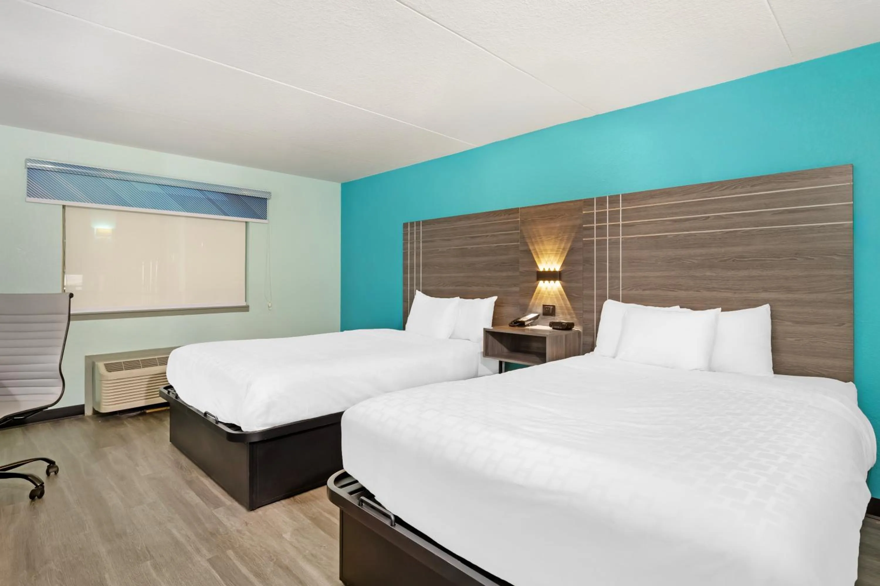 Bed in Ramada by Wyndham Des Moines Airport