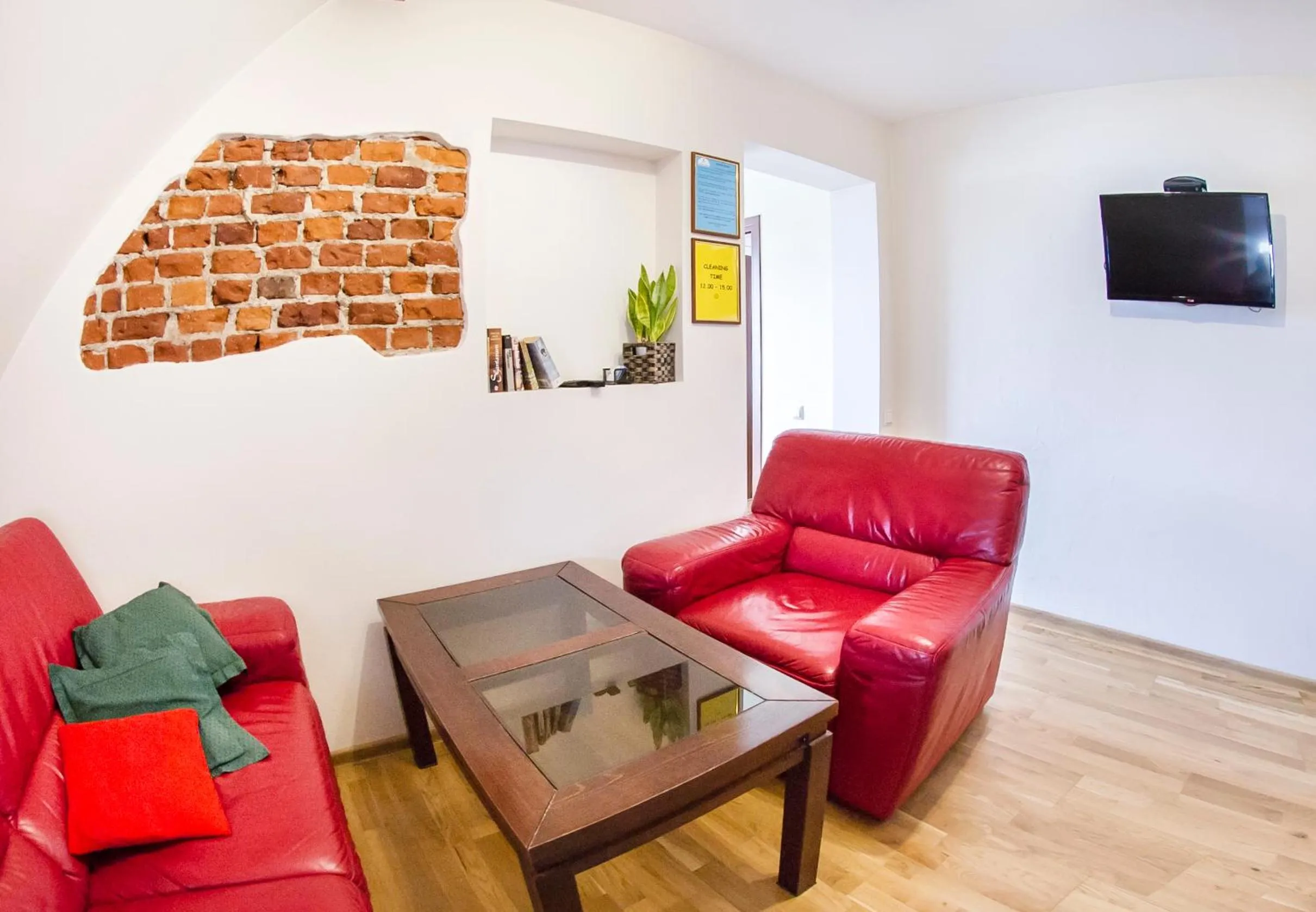 Communal lounge/ TV room in Klaipeda Hostel