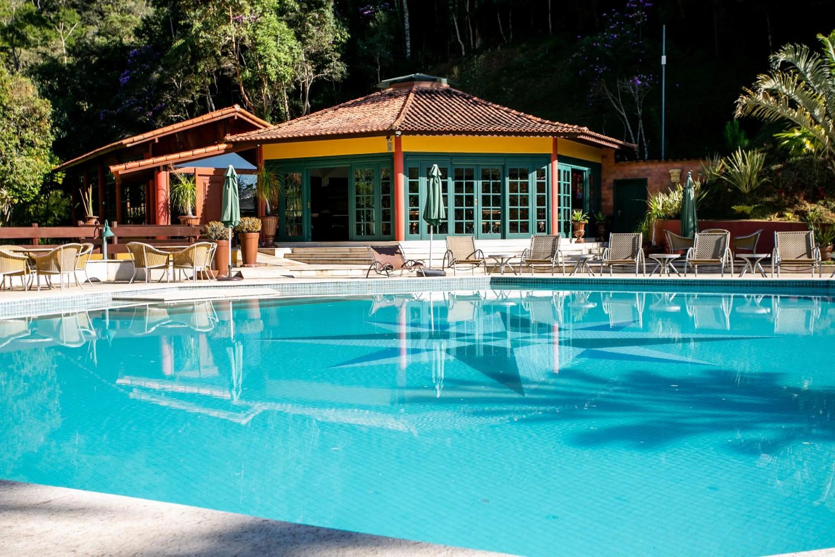 Swimming pool in Bomtempo II Chales by Castelo Itaipava