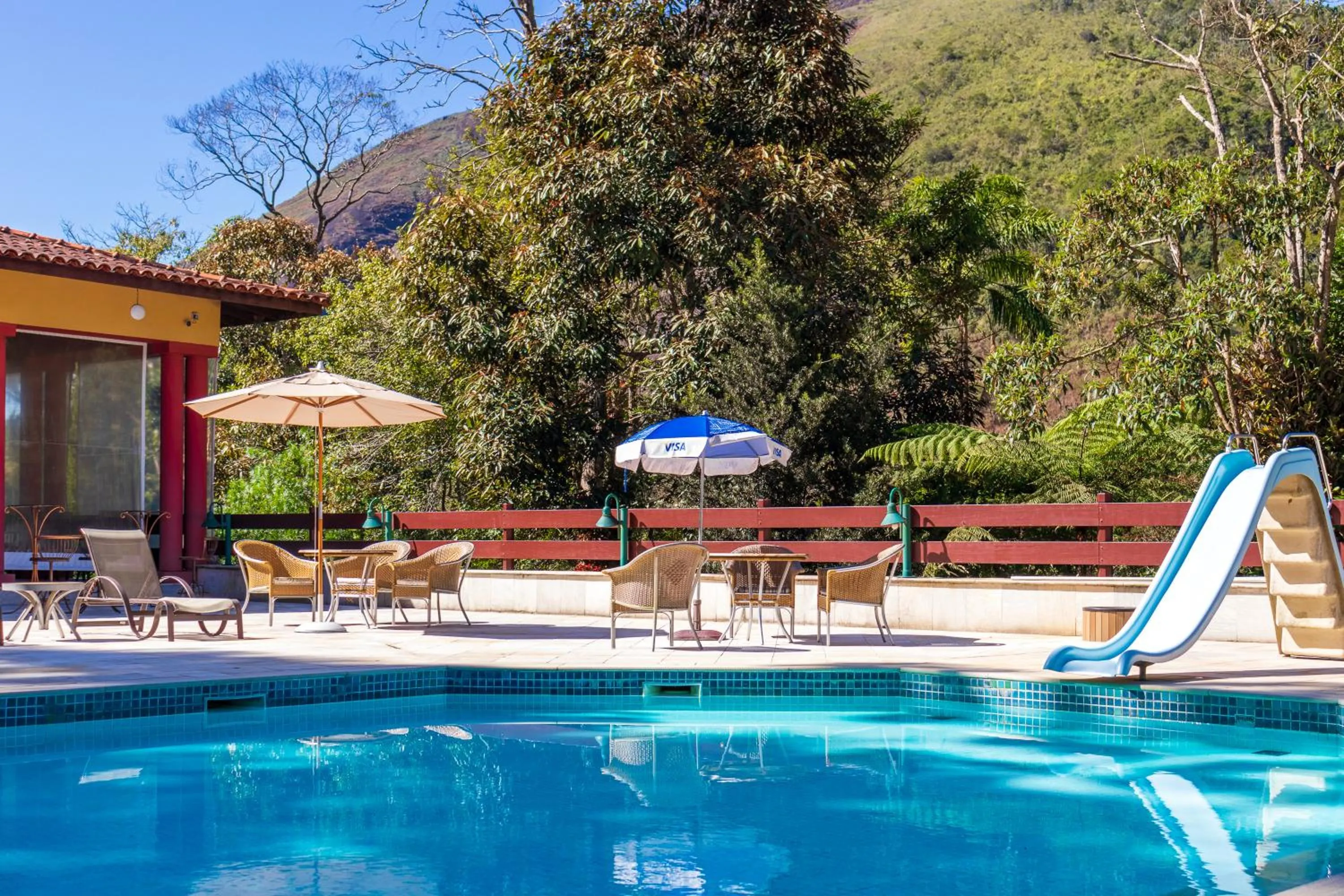 Swimming pool in Bomtempo II Chales by Castelo Itaipava