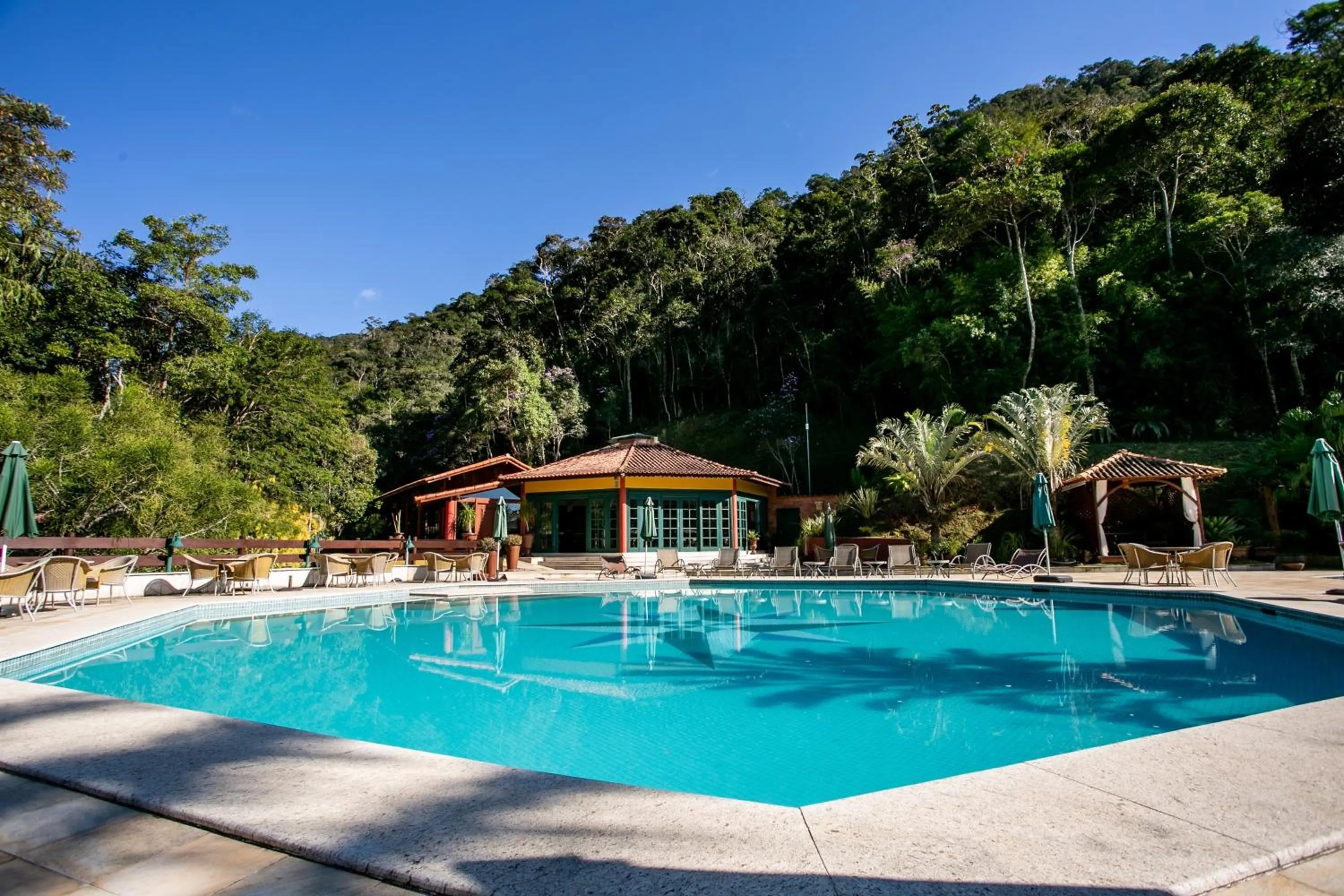 Swimming pool in Bomtempo II Chales by Castelo Itaipava