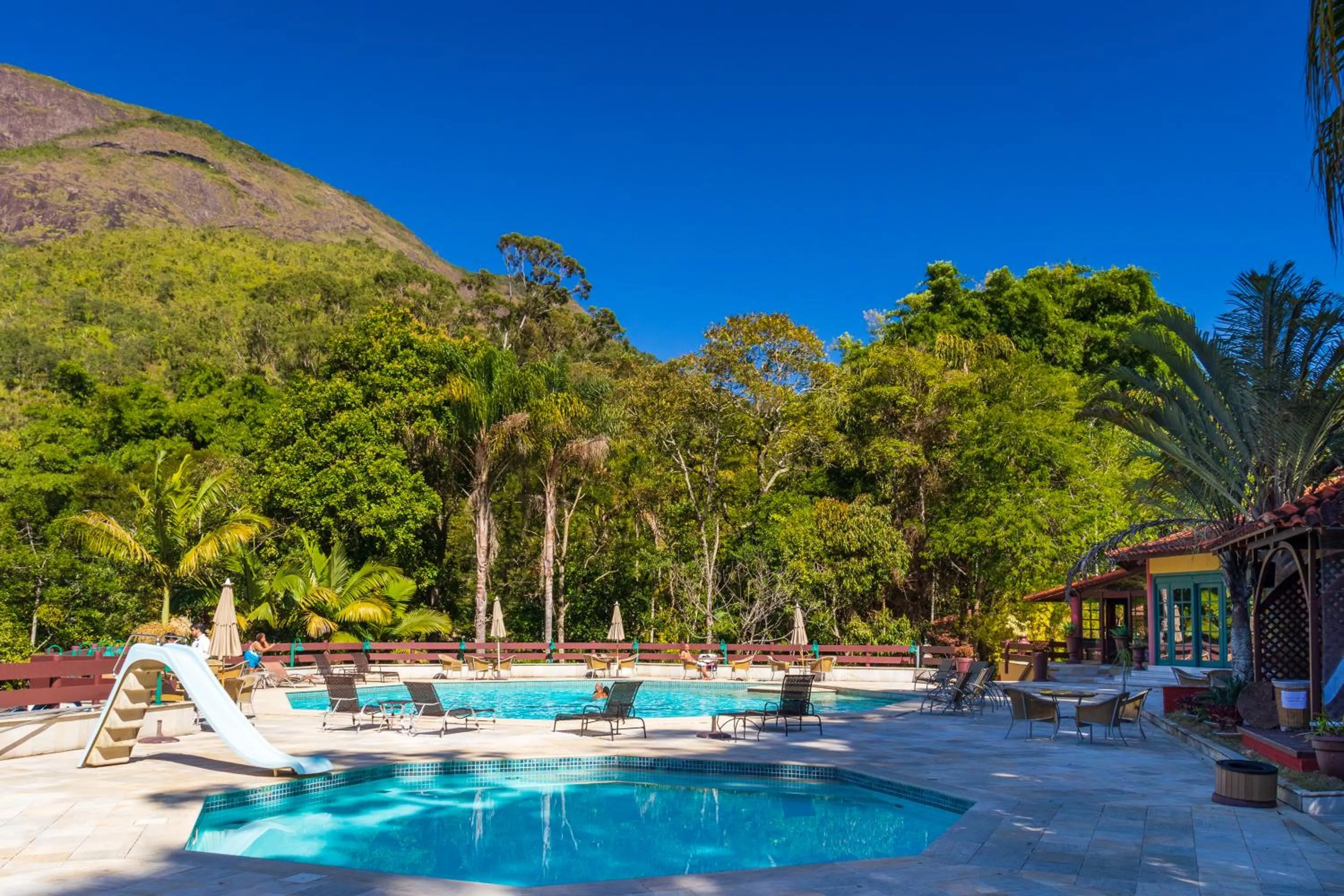 Swimming pool in Bomtempo II Chales by Castelo Itaipava