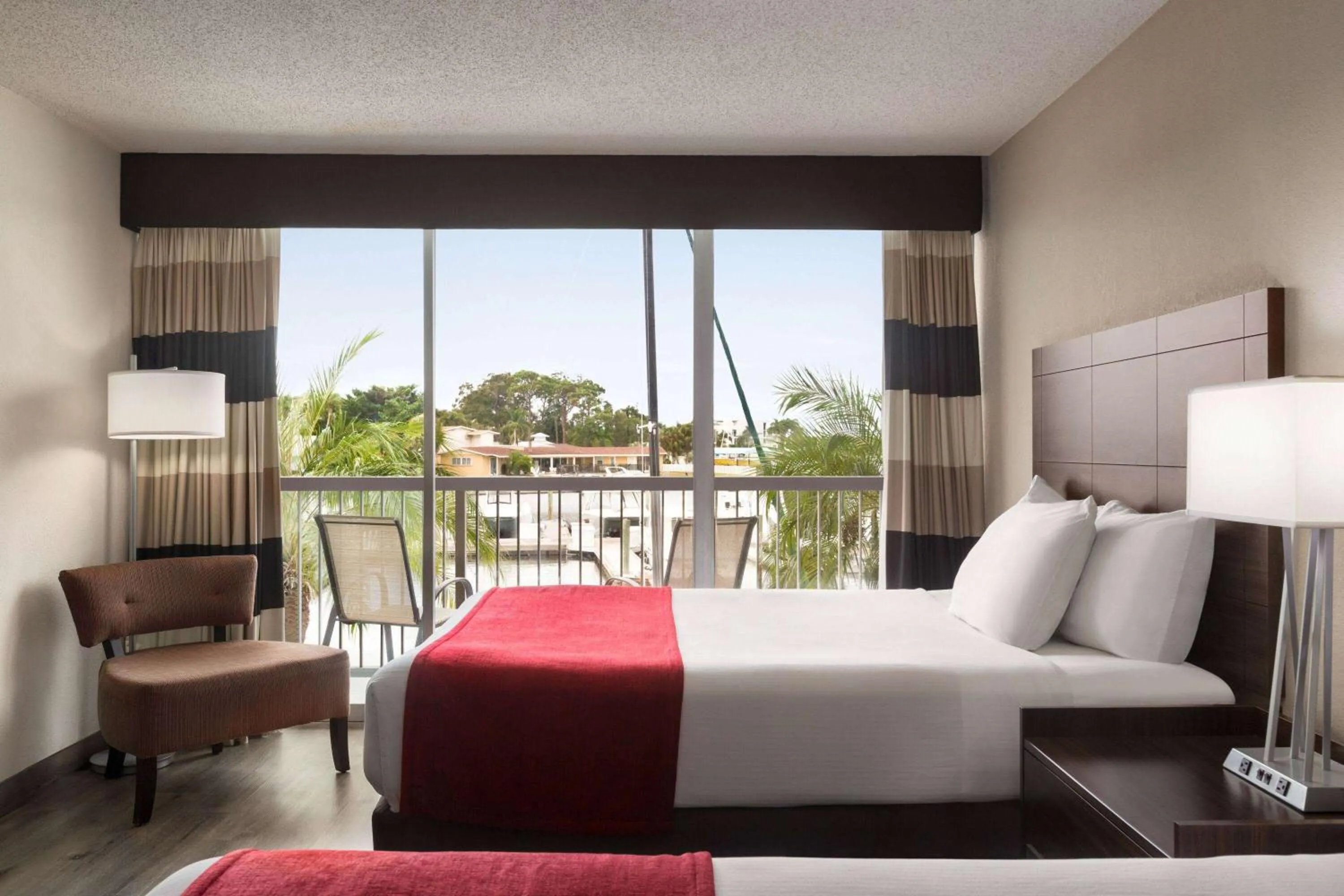 Photo of the whole room, Bed in Ramada by Wyndham Sarasota Waterfront