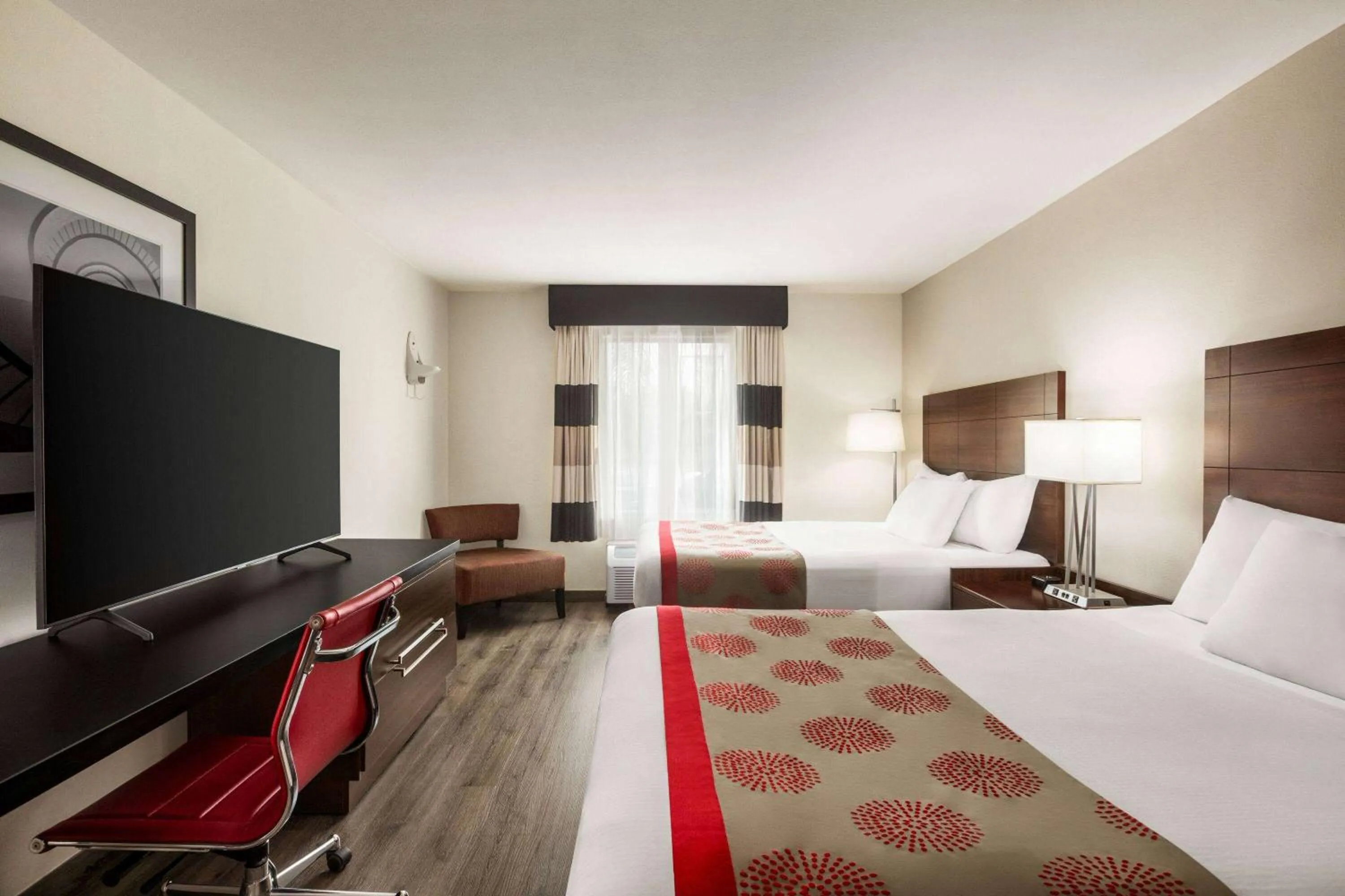 Photo of the whole room, Bed in Ramada by Wyndham Sarasota Waterfront